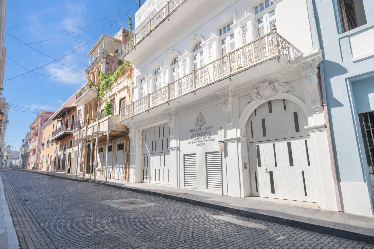 In the heart of Old San Juan, where centuries of architecture frame the city’s most storied streets, 205 Luna rises as one of the district’s most remarkable commercial offerings: a fully restored, 21,899-square-foot historic building anchored by a 1913 theater. Originally home to Cine Luna—one of Puerto Rico’s earliest movie houses—the property has lived many lives, and today stands renewed after an extensive restoration by Universidad Carlos Albizu.  

This rare, mid-scale structure blends institutional quality with architectural heritage, offering a flexible canvas for cultural, educational, corporate, and creative uses. The building’s centerpiece is its meticulously rebuilt theater: an intimate performance and screening hall ideal for lectures, premieres, conferences, and private events. A gracious reception foyer and large interior patio establish an elegant arrival sequence suitable for gatherings, exhibitions, and hospitality activations.  

Through a central stair and elevator, the second and third floors reveal expansive office suites, private offices, conference rooms, and large open work areas—easily adaptable for a single anchor tenant, a hybrid innovation hub, or a multi-tenant professional environment.  

With its restored façade, modern infrastructure, and elevator access, 205 Luna offers the scale, history, and architectural presence rarely found in Old San Juan. Its zoning and configuration support an extraordinary range of possibilities: a cultural and innovation campus, creative industry headquarters, satellite university center, boutique event venue, or corporate flagship with a public-facing theater.  

Offered at $6,500,000, this is a singular opportunity to steward a revitalized landmark and define its next chapter in one of the Caribbean’s most iconic urban settings.

EXECUTIVE SUMMARY:  A Historic Theater and 21,899 SF Commercial Building Positioned for Institutional, Cultural, and Creative Re-Use.  
205 Luna Street is a 21,899 SF, three-level historic building in Old San Juan featuring a fully restored 1913 theater at its core. After decades of disrepair, the property underwent a comprehensive rehabilitation completed in 2018 by Universidad Carlos Albizu, transforming it into a modern institutional-grade facility while preserving its architectural character. Today, the building offers exceptional flexibility for cultural, educational, office, and creative uses.