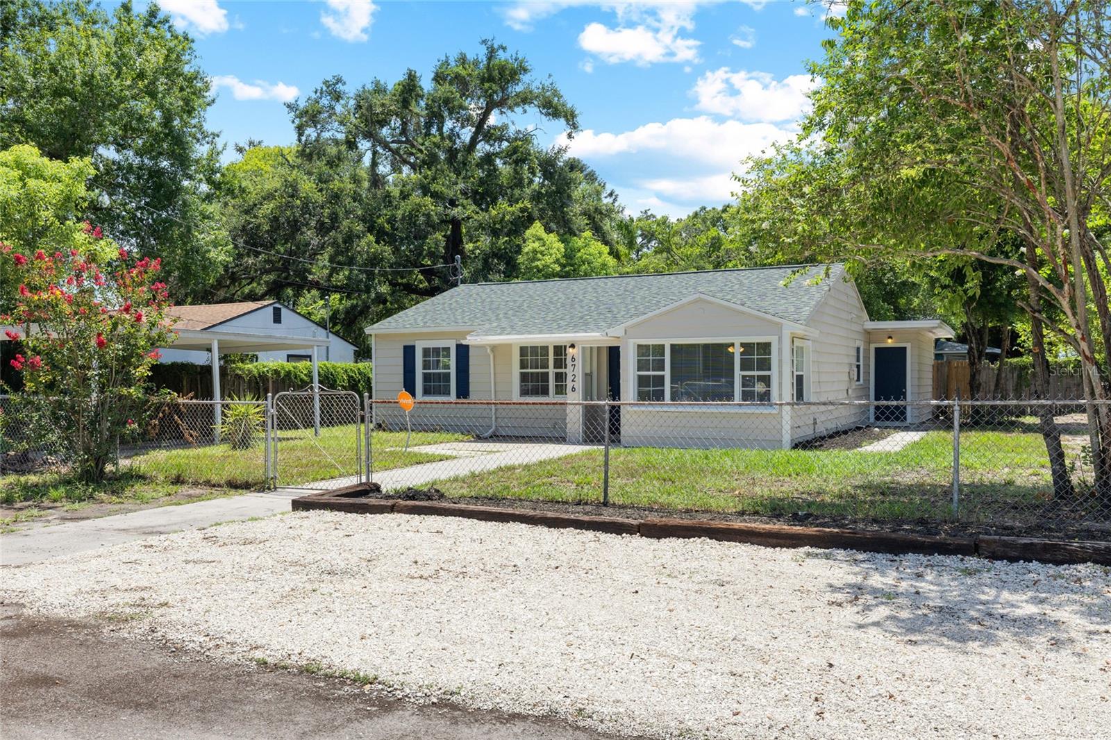 Welcome to this bright and cheerful 4-bedroom, 3-bath Tampa home with a fresh, updated feel throughout. The interior has been freshly painted, giving the home a clean and inviting atmosphere from the moment you walk in. Recent improvements include new tile in two bathrooms, new carpet in one bedroom, and a perfect layout that offers flexibility for everyday living, guests, work-from-home needs, or additional storage.

Outside, the home continues to shine with freshly painted exterior finishes, updated landscaping, and new front gravel parking that adds convenience. The property also features a 1-car carport, separately fenced front and back yards, and major system updates with the roof and HVAC both under 5 years old! Around back, the private pool area creates a fun and relaxing space to enjoy Florida living, whether you are hosting, unwinding, or simply soaking up the Tampa sunshine.

Located near Seminole Heights, this home offers convenient access to local restaurants, parks, I-275, Downtown Tampa, and other popular Tampa destinations.  Make this home your own!