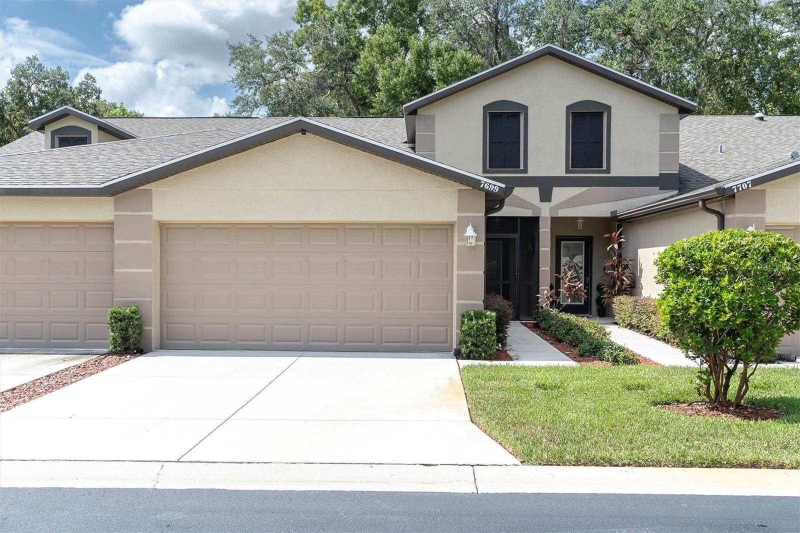 SPECTACULAR VILLA JUST 4 YEARS NEW IN A POPULAR GATED COMMUNITY!   THE GREAT ROOM STYLE FLOOR PLAN IS SO OPEN AND SPACIOUS WITH COVE INSET CEILING FOR ADDED ARCHITECTUAL DETAIL  THE KITCHEN IS LOADED HIGH END WELLBORN CABINETS TOPPED WITH GLEAMING GRANITE COMPLETE WITH ALL STAINLESS APPLIANCES  ENJOY THE CONVENIENCE OF A WALK IN PANTRY!  THE BREAKFAST COUNTER BAR OPENS TO THE DINING ROOM!  THE SPLIT PLAN GIVES MAXIMUM PRIVACY TO THE MASTER SUITE! IT FEATURES A COVE CEILING AND EVERYONE'S FAVORITE WALK IN CLOSET AND THE PRIVATE BATH HAS DUAL SINKS AND STEP IN SHOWER!   ENJOY THE BREEZES ON THE SCREENED PORCH OVERLOOKING THE WOODS!  SOME EXTRAS INCLUDE ALARM SYSTEM, LEAF GUARDS, WATER SOFTENER, PLANTATION SHUTTERS, REMOTE CONTROL FANS AND MORE!   VILLAS GO VERY FAST IN THIS COMMUNITY!  HESITATE....AND YOU'LL BE TOO LATE!