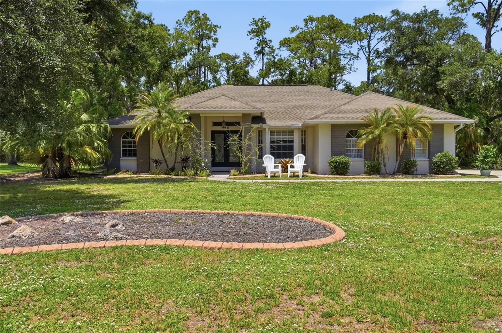 Rarely does an opportunity arise to own one of the most expansive and private estates in the coveted Mill Creek community.  This exceptional home spans nearly an acre and a half of lush land, offering a level of tranquility and space that is increasingly hard to find.  Situated in a preferred X flood zone (no insurance required), the massive lot is a true sanctuary, bordering no neighbors directly in the front or rear and sitting just across from a serene, rarely-used private park.  The home itself carries a legacy of care and thoughtful design, featuring three spacious bedrooms and two and a half beautifully renovated bathrooms.  The interior radiates elegance with soaring vaulted ceilings, while the floor plan emphasizes convenience with generous walk-in closets in every single bedroom.  outdoor kitchen that features a built-in grill, sink with hot and cold water and refrigerator is ready for all your pool and backyard entertaining. The kitchen has custom granite countertops with cabinets, a breakfast bar and pantry. The floors boast either new laminate flooring or tile for easy maintenance and clean up. The spacious Master bedroom has French doors leading to the patio and pool area, new laminate floors, separate his and her walk-in closets that lead to the Master Bathroom. The Master Bathroom features a new stylish, stand-alone soaking tub, separate shower and dual sinks. Cathedral ceilings and pocket doors help make this home feel spacious. The 2nd and 3rd bedrooms feature large walk-in closets and new laminate floors. New stainless kitchen appliances and tankless hot water heater.  A standout feature of the property is the large enclosed garage, which provides not only secure parking but also tons of storage for all your work or organizational needs.  The vast acreage ensures that the potential here is truly limitless.  Whether you envision a massive, detached RV garage, a professional-grade workshop, or secondary utility structures to protect your toys from the elements, there is more than enough room here to build your dreams.   Entertaining is effortless on this estate, which features a sprawling driveway capable of accommodating up to 24 vehicles for gatherings.  The outdoor living space is highlighted by an inviting martini pool and a dedicated grill area, perfect for hosting weekend parties or enjoying quiet Florida evenings in the shade of nature.  Despite the immense size and privacy of the lot, the property remains governed by low HOA fees and no CDD ensuring the neighborhood's beauty is preserved without high overhead.  Beyond the property lines, Mill Creek offers a lifestyle of unparalleled convenience and A rated schools.  You are positioned within easy reach of the world-renowned Beaches of Anna Maria Island and Siesta Key, while the nearby Lakewood Ranch Main Street and University Town Center provide premier shopping and dining.  With swift access to I-75 and the Sarasota-Bradenton International Airport, commuting to Tampa or St. Pete is a breeze.  This is more than just a house; it is a sprawling canvas ready for its next chapter.  Schedule your private tour today to experience the scale and serenity of Mill Creek’s finest.  Professional Photos coming soon.