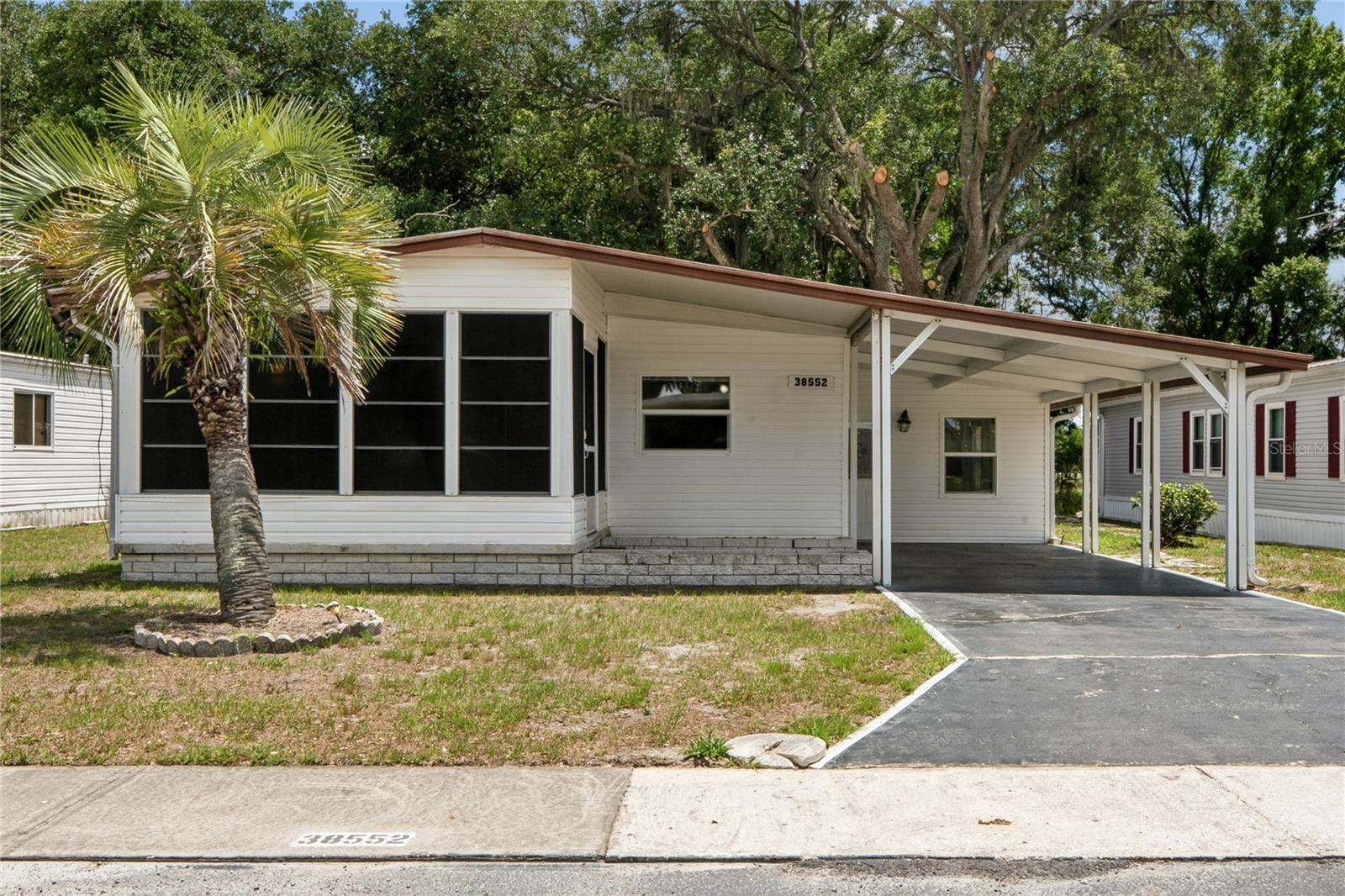 WELCOME TO SHADY OAKS! Shady Oaks is a 55+, pet friendly community where you own your land. This is a
great opportunity to become part of a great community and in a GREAT LOCATION! This home has been
renovated and ready for your everyday Florida Living- From New Flooring, Cabinets, New Shelving in the
Closets and Pantries. Roof has been inspected, HVAC is 2022 and has just been serviced, New Hot Water Tank.
This home has two enclosed porches, a carport, indoor laundry unit located off the enclosed porch.The back
yard is a peaceful place to be, it is shaded and you have no rear neighbors, great for family barbecues. The
community offers a low HOA fee of $500.00 a year and offers a community pool, a clubhouse, shuffleboard,
and lots of activities to keep you busy throughout the year. Pets (see Pet Restrictions) and Golf carts are allowed.
Make an appointment today to see this Updated Move In Ready Home.