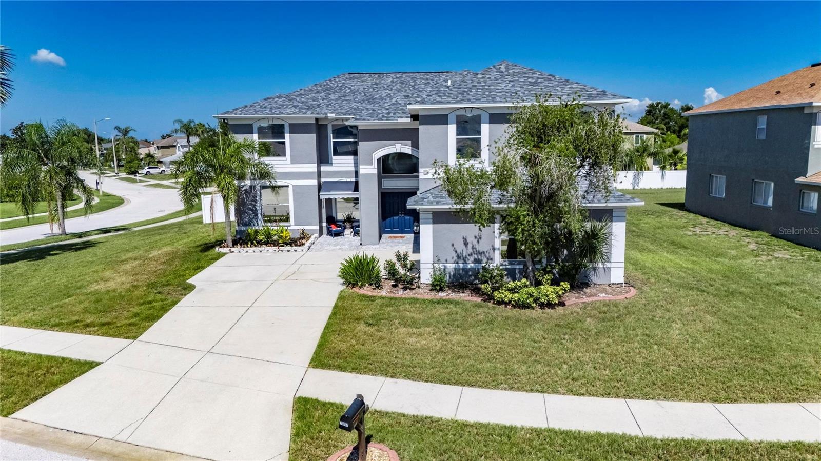 13007 Oakmont Wood Court | 5 Bedrooms | 3.5 Bathrooms | 3,720 Sq Ft | Summerfield Village | Riverview

13007 Oakmont Wood Court is a spacious 5-bedroom, 3.5-bathroom home offering 3,720 square feet of living space on a quarter-acre corner lot in Summerfield Village. Located in Flood Zone X with no flood insurance currently required, this property combines size, flexibility, and major system updates in one of Riverview's most established communities.

The floor plan was designed with both everyday living and multi-generational flexibility in mind. The kitchen serves as the heart of the home with solid wood cabinetry, stone countertops, a large center island, dual refrigerators, and an abundance of storage and workspace. Five-panel sliding glass doors connect the main living area to the oversized covered lanai, creating a seamless transition between indoor and outdoor living.

A dedicated 14'x14' office on the first floor provides the flexibility to serve as a home office, playroom, guest space, or potential additional bedroom. Upstairs, the home features four secondary bedrooms, including two connected by a Jack-and-Jill bathroom. A separate 14'x9' bonus flex room is already plumbed for a sink and could easily function as a hobby room, fitness area, study space, additional bedroom, or future in-law setup.

The primary suite offers exceptional space with a 27'x14' bedroom, large walk-in closet, dual vanities, and an oversized walk-in shower featuring dual rain shower heads. A whole-home water heater was installed in 2020, with a dedicated instant electric water heater added in 2021 to serve the guest wing.

Major improvements completed in 2020 include a new roof, new HVAC system, and updated water systems. Additional upgrades include a water softener and filtration system, built-in pest control system, heavy-duty garage storage shelving, and more than $150,000 in improvements made by the current owners.

The fully fenced backyard was designed for gathering and recreation with a custom paver fire pit area and a private quarter basketball court added in 2022. The oversized lot provides room to spread out while still maintaining manageable outdoor maintenance.

Summerfield Village residents enjoy access to community pools, fitness facilities, clubhouse amenities, tennis courts, playgrounds, and a dog park. With no CDD fees and an HOA of only $135/quarter, the community continues to be one of Riverview's most affordable options for buyers seeking extensive amenities.

The sellers are also willing to discuss the sale of furnishings separately, creating a truly move-in-ready opportunity for the next owner.