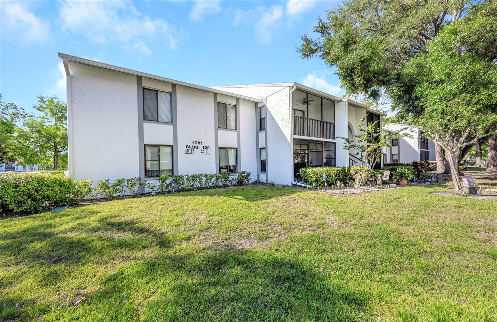 One or more photo(s) has been virtually staged. This second floor corner condo provides ample privacy with no upstairs neighbors while featuring a spacious layout of 3 bedrooms, 2 baths, abundant natural light for comfortable living in a great community. 

The living room opens to a screened lanai through sliding glass doors, an ideal spot for morning coffee or relaxing evenings. 

The layout includes a dedicated dining area connected to the open kitchen with stainless steel appliances, ample storage tucked behind white shaker cabinetry, counter height seating, and full-size interior laundry area conveniently located just off the kitchen.

The primary bedroom includes a private ensuite bath with a glass enclosed step in shower and generous closet space. Two additional bedrooms provide flexibility for guests, a home office, or bonus room, and share a full guest bathroom.

Residents of Pine Ridge at Lake Tarpon enjoy access to community amenities including a pool, spa, clubhouse, and tennis courts, all set within a well maintained neighborhood surrounded by mature landscaping. Flood Zone X, LOMC available upon request. No CDD. The HOA includes cable, internet, sewer, water, and trash.

Located close to nearby parks, and the Gulf beaches, while feeling peacefully tucked away. A short drive to the Sponge Docks, Fred Howard Park, Anclote Key Preserve, the Pinellas Trail, and Downtown Tarpon Springs.

An amazing opportunity for those seeking a move-in ready low maintenance condo. 

**Use the seller’s preferred lender and receive a no cost 1-0 permanent rate buy down. Jonathan Ferrante.