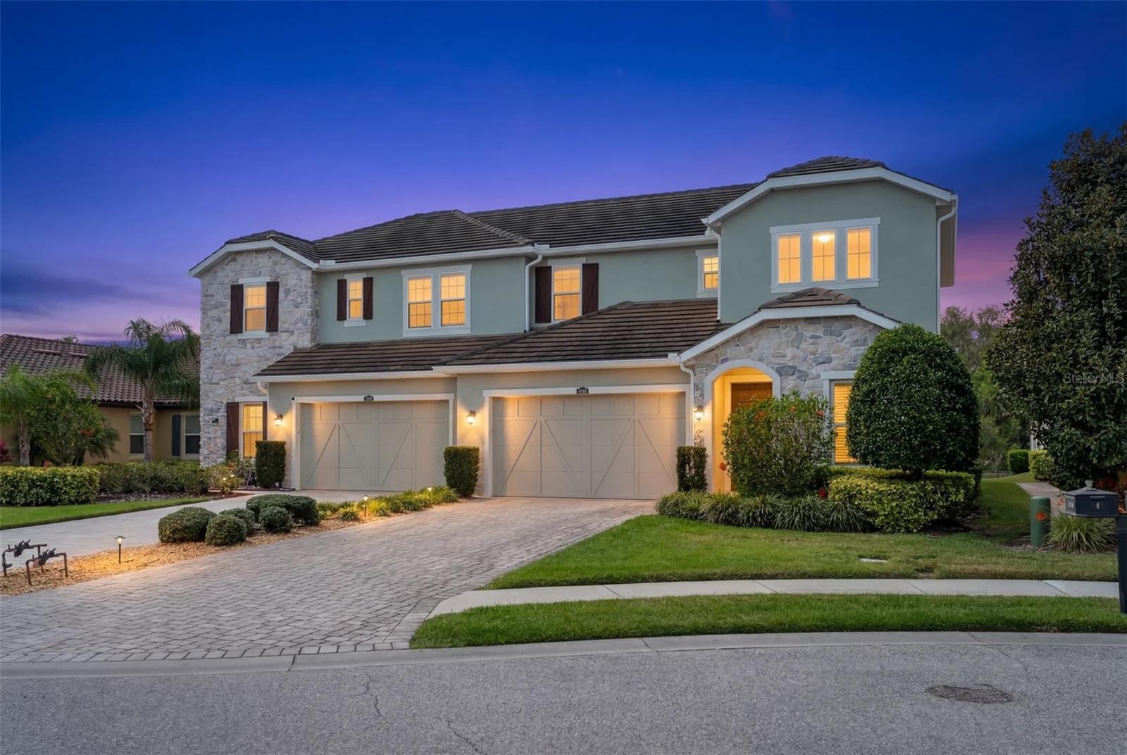 ***Seller Financing available qualified buyers with acceptable terms. Or closing cost assistance or interest rate buydown available for qualified buyers through preferred lender, Eads Mortgage. Terms and conditions apply.***

Experience the ultimate Florida lifestyle in this stunning residence located in the highly desirable Arbor Grande community of Lakewood Ranch! This spacious three-bedroom, three-bathroom home spans over 3,300 square feet, offering a perfect blend of elegance and comfort. As you step inside, you are greeted by soaring ceilings that enhance the open and airy feel of the home. The expansive floor plan seamlessly connects the living, dining, and kitchen areas, making it ideal for both daily living and entertaining.

The master suite serves as a private retreat, boasting a spa-like bathroom with a walk-in shower and dual vanities. Convenience is key with an additional bedroom on the first floor, while the second level features a large loft area complete with a wet bar—perfect for a media room or hobby space. The oversized upstairs bedroom includes a large closet and full bath, providing plenty of room for guests or family.

Outside, enjoy breathtaking sunsets from your screened-in lanai facing westward. This home sits directly across the street from the private villa-only amenities, putting relaxation right at your doorstep. Arbor Grande is a resort-style, maintenance-free community featuring a clubhouse, fitness center, two heated pools, spa, pickleball, bocce ball, and a private dog park. With an onsite manager and a very active social calendar, there is always something to do! Located in the heart of Lakewood Ranch, you are minutes away from excellent dining, shopping, and Main Street, and just a short drive to world-famous Gulf beaches. This meticulously maintained home is move-in ready and waiting for you!