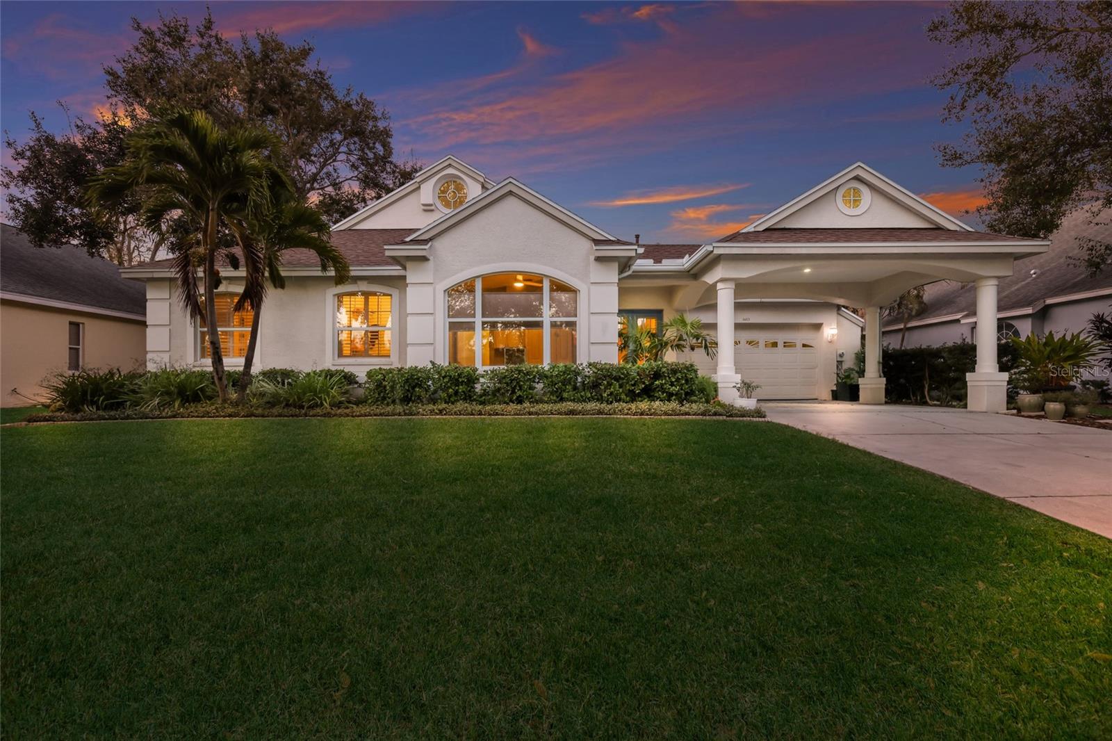 WELCOME to this BEAUTIFULLY maintained one story, 4 bedroom plus den, 2 bath POOL home with a 2 car garage plus carport, located in the highly sought-after BOATING community of The Inlets at Riverdale. As you enter through the double doors, you are immediately welcomed by a bright, open floor plan with a clear view straight through the living room to the pool beyond, while ELEGANT ARCHES and decorative COLUMNS add unique character to the main living areas. The UPGRADED kitchen features wood cabinetry, granite countertops, a tiled backsplash, NEW appliances, and a center island with seating, making it perfect for entertaining or enjoying everyday meals. The spacious primary suite is privately tucked away on the opposite side of the home and offers a peaceful retreat with its own ENSUITE bathroom complete with a garden tub, walk-in tiled shower, and vanity, while the other additional bedrooms are located on the other side of the home and share a full bathroom with a single vanity and a tub/shower combo. The large living room is filled with NATURAL LIGHT and showcases two sets of sliders and expansive windows, all offering relaxing views of the pool area. Step outside to your PRIVATE, screened-in lanai where you’ll find a HEATED POOL and SPA with concrete flooring, and a large covered area, making it the perfect place to unwind or entertain year-round. Recent upgrades include a NEW ROOF, new garage door MOTOR, EV CHARGER, and a REVERSE OSMOSIS SYSTEM in the kitchen. The Inlets at Riverdale offers an exceptional lifestyle with DIRECT boating access to the Manatee River and the Gulf of Mexico and community amenities including walking trails, tennis courts, pickleball, a playground, BOAT RAMP, kayak launch, and fishing dock, all just minutes from I-75, downtown Bradenton’s Riverwalk, major airports, Lakewood Ranch, fine dining, shopping, and the FAMOUS GULF BEACHES. Don't wait to make this your home and begin your FLORIDA Lifestyle!