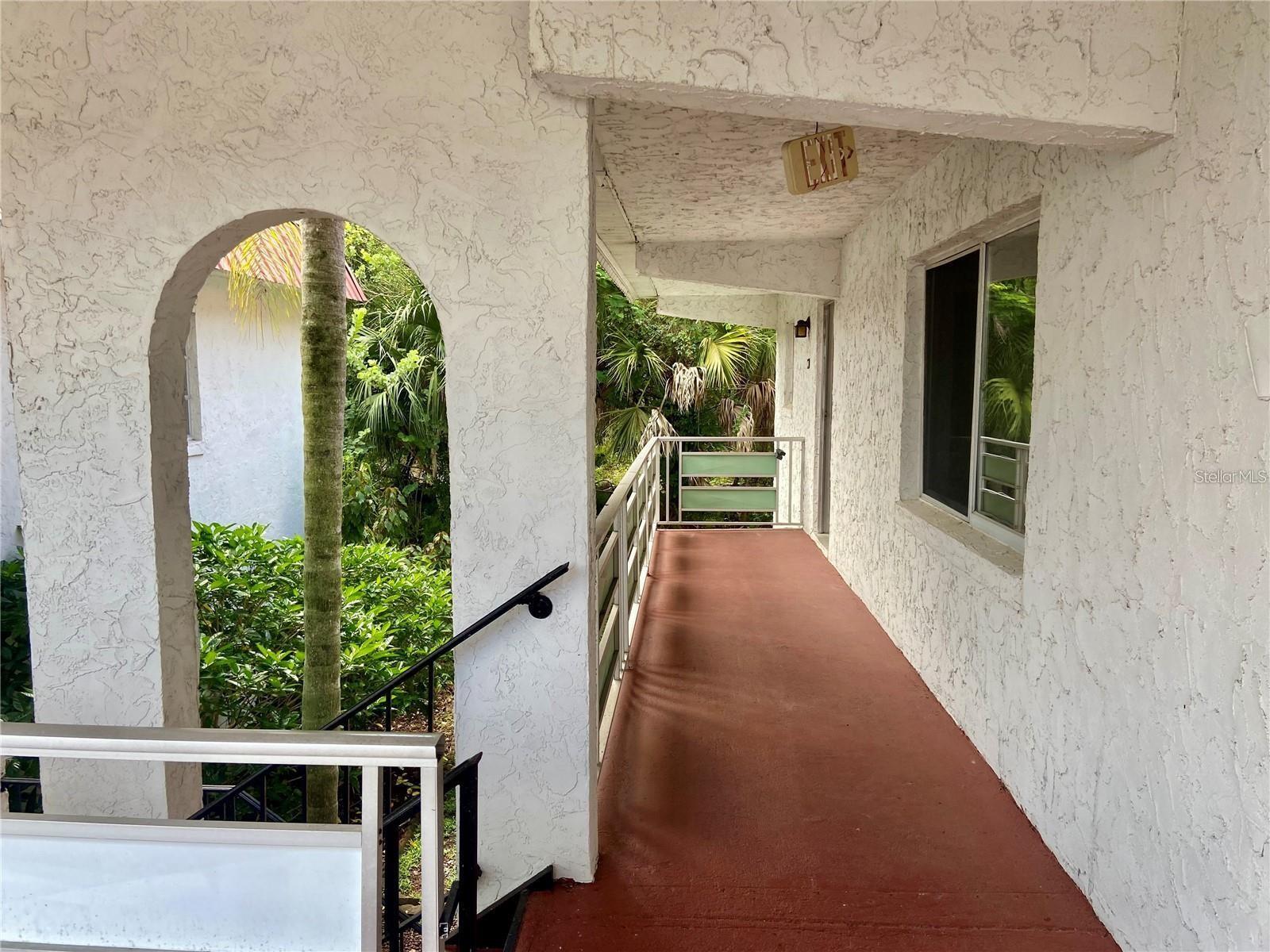Spacious 2-bedroom, 2-bath upper corner condo in the Barcelona Building of Orchid Springs, an all-ages community. This desirable end unit offers natural light and views from three sides, plus added privacy with minimal foot traffic. Recent updates include luxury vinyl plank flooring throughout, smooth ceilings, neutral zero-VOC paint, and A/C maintenance completed in May 2026. The updated kitchen features 17 cabinets, 10 drawers, and a pantry, while the spacious primary suite offers a walk-in closet and en-suite bath. Assigned parking is located just below the unit. The monthly HOA fee of $312.69 covers exterior maintenance, grounds care, water, sewer, trash, gas service, pest control, common laundry facilities, and capital reserves. Conveniently located near LEGOLAND Florida and between Orlando and Tampa, with easy access to Winter Haven's renowned Chain of Lakes.