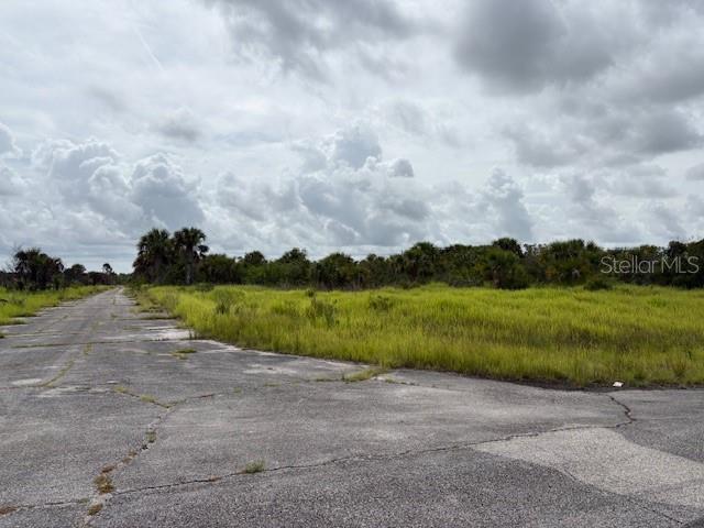 Investment property for future use on this 1/4 acre lot.  Utilities are currently not present, however, electric lines are not far away. It does not appear that the lot is currently buildable at this time. It is a recorded Plat with roads in, just no other infrastructure