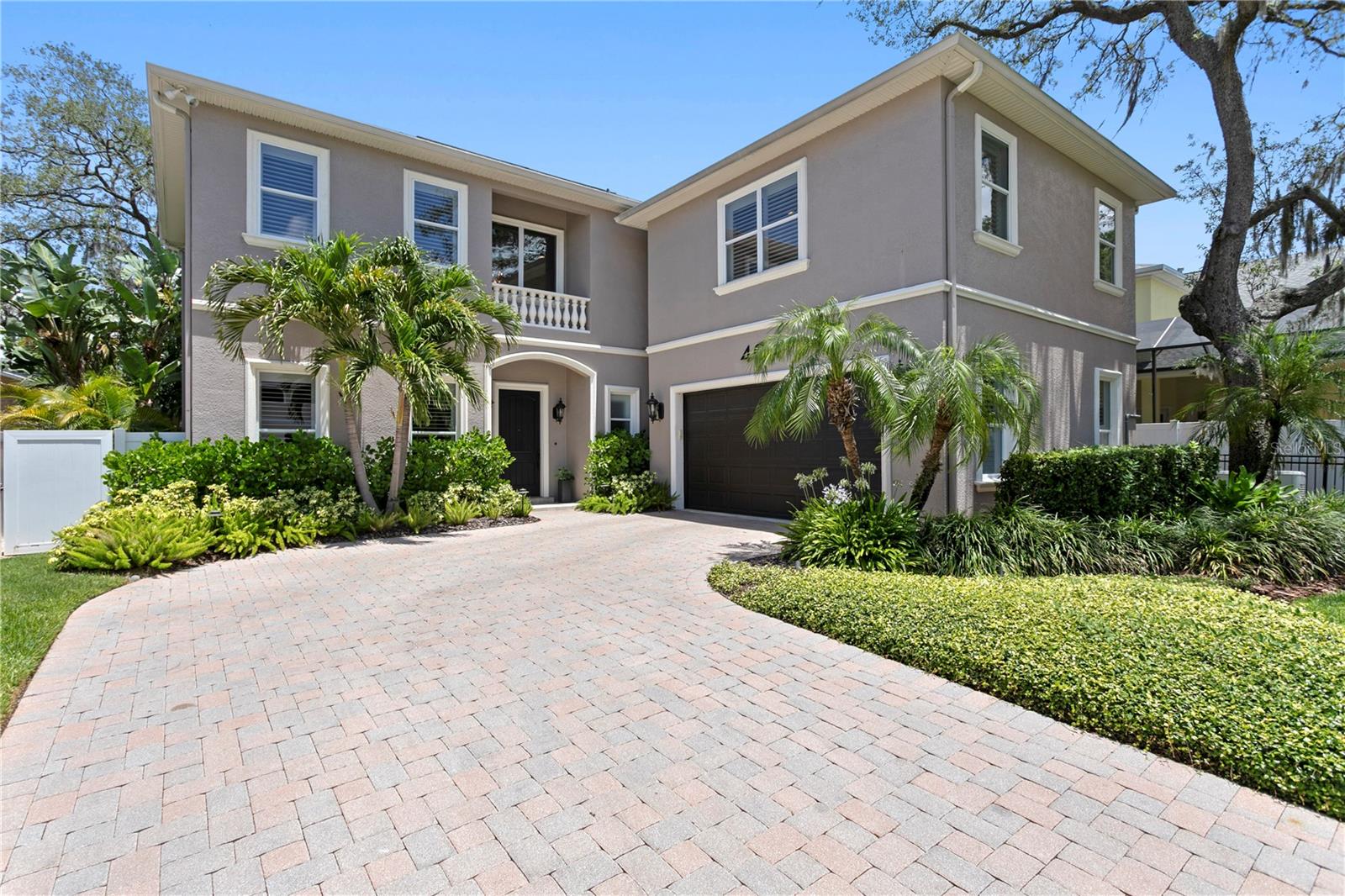 Virtually Staged. Situated on a beautifully elevated homesite in one of South Tampa’s most desirable neighborhoods, this stunning transitional Mediterranean residence seamlessly blends timeless architecture with sophisticated modern living and ideal entertaining space. Offering 4 bedrooms, 3.5 bathrooms, and an exceptional collection of recent designer renovations, this home delivers the perfect balance of elegance, comfort, and functionality.

Thoughtfully updated throughout, the entire first floor has been transformed with exquisite attention to detail, including a beautifully redesigned chef’s kitchen, spacious living room, elegant dining room, private office, stylish wet bar, and refined powder bath. The luxurious primary suite has also been completely renovated, creating a serene retreat highlighted by a spa-inspired bathroom and sophisticated finishes.

Designed for effortless indoor-outdoor living, the backyard rivals a private resort. A heated saltwater pool and spa feature a sun shelf with resort-style loungers, while the fully equipped outdoor kitchen includes a grill, beverage refrigerator, and oversized umbrella canopy for year-round entertaining. Lush tropical landscaping, professional outdoor lighting, and a full irrigation system create a breathtaking setting both day and night.

Constructed with quality and longevity in mind, this exceptional home offers 20’ elevation, dual-pane impact windows, plantation shutters, custom wood blinds, a whole-home generator, and the peace of mind that comes with high-quality construction and a central location outside of a flood zone.

Combining luxurious renovations, resort-style outdoor living, and an unbeatable South Tampa neighborhood, with high elevation, no flood zone location, impact windows and whole-home generator, this is a rare opportunity to experience the very best of Florida luxury living.