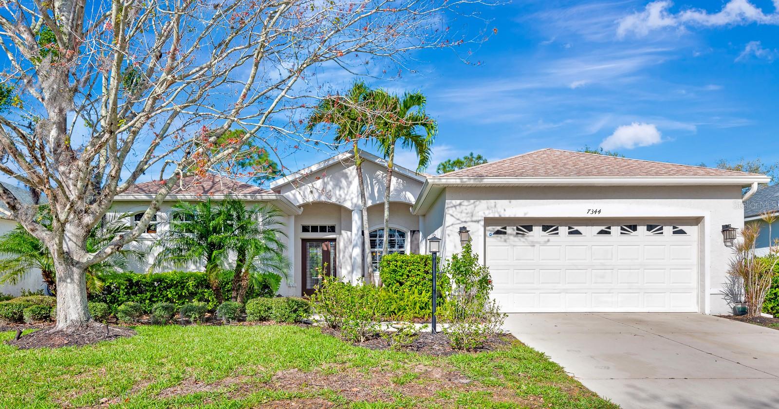 Welcome to an exceptional residence in Riverwalk, one of Lakewood Ranch’s most coveted communities. This  3-bedroom, 3-bathroom pool home perfectly balances architectural elegance with effortless daily functionality. Framed by mature, manicured landscaping, the property spans over 2,200 square feet of airy, open-concept living.The heart of the home is a grand, sweeping kitchen that flows seamlessly into a sunlit breakfast nook, anchored by a striking aquarium window overlooking your private retreat. Sliding glass doors merge the interior with the outdoor living space, opening to a magnificent, large in-ground pool and an expansive backyard that offers a front-row seat to unparalleled Florida sunsets. A dedicated pool-access bathroom and shower provide exceptional convenience for guest hosting and indoor-outdoor transitions.Inside, soaring ceilings, crown molding, plantation shutters, and rich hardwood floors create an ambiance of refined comfort. The flexible bonus room effortlessly adapts to a private study or home office, while the bedrooms feature custom built-in closet organization systems. Complete with a 2-car garage, this serene sanctuary places you just minutes from top-rated schools, fine dining, shopping, and pristine Gulf Coast beaches.
