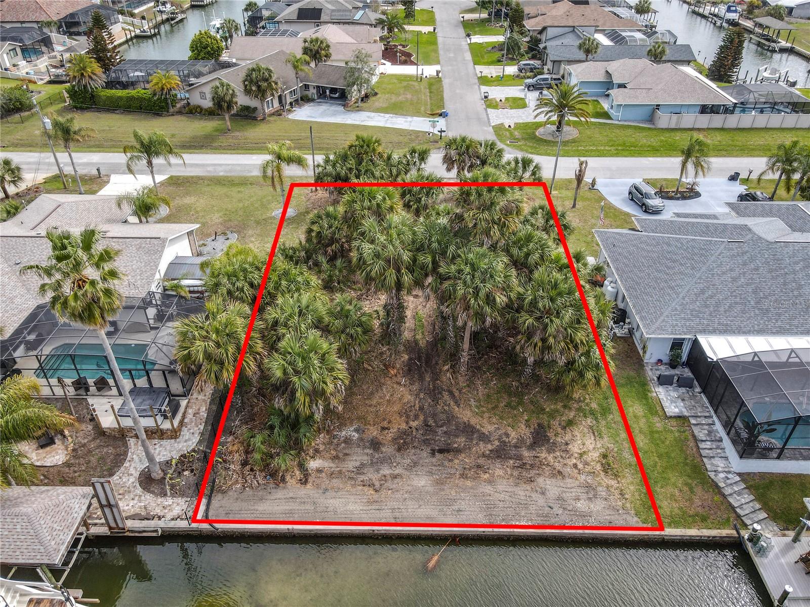 Unbeatable Location and Accessibility! 80’ Bulkheaded Saltwater Canal homesite. Build Your Waterfront Home in Paradise! This is your chance to live along the water on a Saltwater Canal in Palm Coast's "Sailboat Country" neighborhood—a dream spot for boating enthusiasts. This lot with sea wall, deep water access, and no fixed bridges is only a quick 5–10-minute boat ride to the Intracoastal Waterway and then on to Matanzas Inlet. This property is one of the last prime saltwater homesites available in Sailboat country. Whether you love fishing, boating, or simply watching dolphins and manatees from your backyard, you'll find plenty to enjoy here. In addition to its tranquil waterfront setting, this property offers exceptional convenience for everyday living. Residents will appreciate being just moments away from a variety of shopping options, ensuring all your retail needs are easily met. Quality medical facilities are also close by, providing peace of mind and quick access to healthcare services when needed. Families will find reputable schools within a short drive, making this an ideal spot for those seeking a balanced lifestyle. To top it off, beautiful Florida beaches are only a short distance away, allowing you to enjoy sun, sand, and surf whenever you desire. Easy access to I-95 and US 1 makes travel to St. Augustine or Daytona effortless