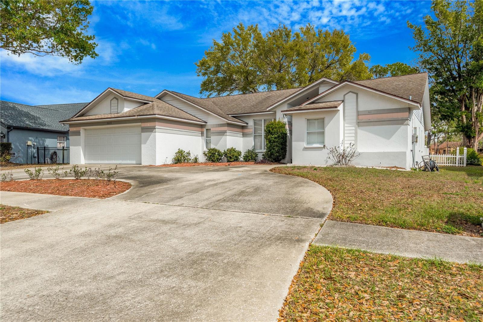 Golf Course Living with Endless Potential! Welcome to this 4 Bedroom, 2 Bath golf course home offering 2063 sq ft of living space and the relaxed charm of true Florida living. Situated on a beautiful lot, this home features a circular driveway, providing both convenience and great curb appeal. Inside, you'll find a spacious layout with plenty of natural light and room to make it your own. This home offers a fantastic opportunity for buyers looking to add their personal touches, with pricing that reflects the opportunity for updates and customization. The primary suite features a wood planked vaulted ceiling, ensuite bath and sliding doors out to the screened in patio. Step outside to a fenced backyard overlooking the 13th fairway, perfect for enjoying morning coffee, entertaining guests, or simply soaking in the peaceful golf course setting. Whether you're searching for a primary residence, seasonal retreat, or an investment opportunity, this property offers location, space and incredible potential. Come experience the lifestyle that golf course living has to offer!