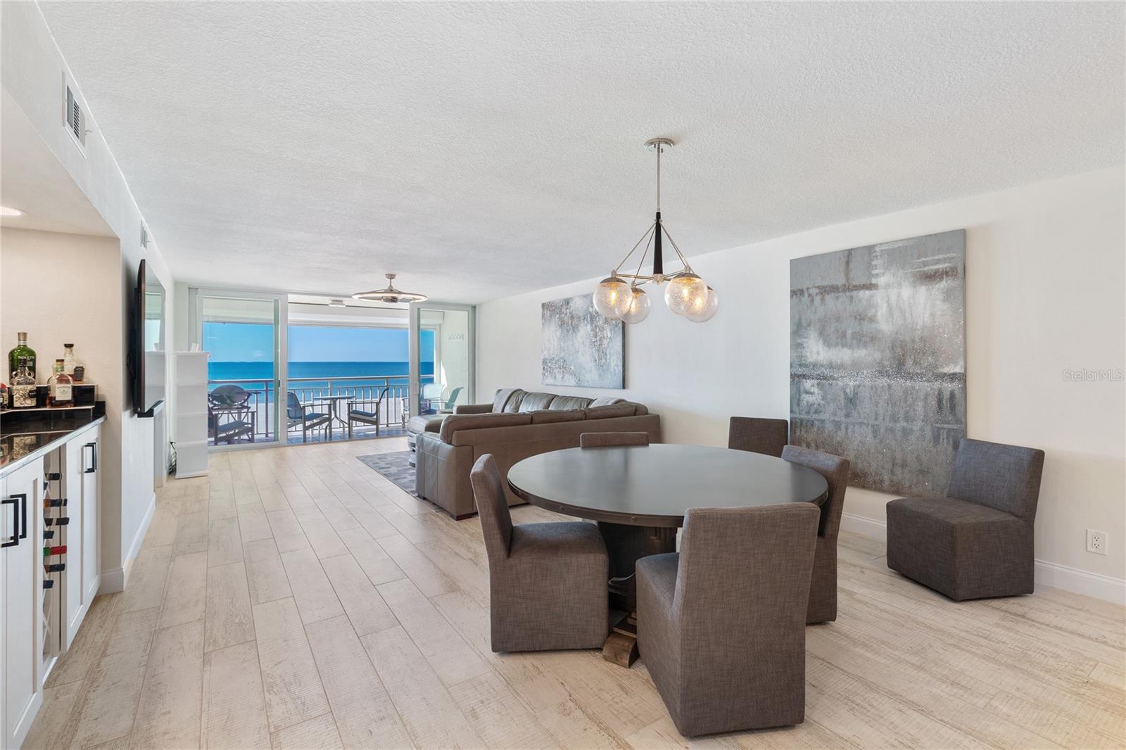 DIRECT, GULF-FRONT CONDOMINIUM! This home is being sold furnished. This beautiful waterfront home has been remodeled from ceilings to the floors.  Ceramic tile floors that look and feel like wood.  Smooth ceilings, Hurricane impact windows and sliding glass doors, Electric storm shutters on the outside of your new balcony and the other Gulf-front windows, both bathrooms are new too.  TRANQUILITY IS EVIDENT FROM THE MOMENT YOU WALK THROUGH THE BEAUTIFUL DOUBLE DOOR ENTRY.  Spacious gourmet kitchen with granite, stainless steel appliances and built in wine fridge.   The unit offers an open concept living space with wet bar. Split bedroom plan with two bedrooms and two baths.  PRIMARY SUITE COMPLETE with private spa like bath and his and her closets.  THIS GEM WILL NOT LAST!  This location is so perfect.  Short walk to the Shoppes on Sand Key, Sand Key Park and Clearwater Beach once again we have the best beaches in the USA.  Another great feature is the Trolley that can take you as far South as Pass-a-grill beach and as far North as Dunedin.  The trolley is so easy to hop on and off along which ever route you choose.  Come see this beach house today.