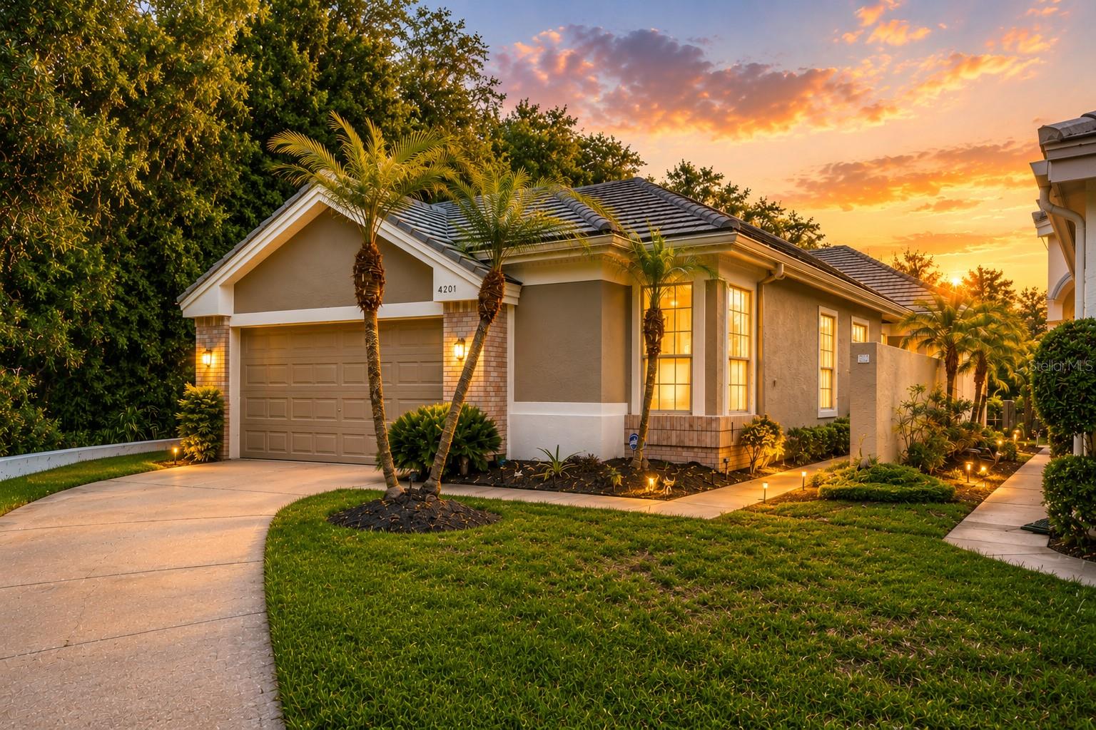Virtually Staged. Waterfront Villa with Pond & Conservation Views | Maintenance-Free Living in Parkside at Lansbrook. Wake up to water views. Imagine morning coffee on a screened lanai with nothing but pond water, conservation land, and quiet in front of you. That's everyday life in this move-in ready, maintenance-free villa — tucked on the premier waterfront lot in Parkside at Lansbrook, a quiet enclave in Palm Harbor's East Lake corridor where opportunities like this rarely surface. Highlights: 3 bedrooms, 2 baths, 2-car garage, 1,737 heated sq ft. Premier waterfront lot with pond and conservation views on a quiet cul-de-sac. Open floor plan with high ceilings, decorative fireplace, and diagonal tile. Covered screened lanai overlooking the water. Tile roof (2016) and A/C (2018). Maintenance-free: lawn and grounds cared for by the HOA. Single-story living with no interior steps. Loved by only two owners, this single-story home carries a real sense of care throughout. An 8 foot leaded-glass front door welcomes you into light-filled living and dining spaces, while the kitchen and breakfast nook keep those water views in constant view. The primary suite feels like its own private escape, complete with a walk-in closet and spa-style en-suite bath — dual sinks, a glass-enclosed shower, and a separate soaking tub. Two additional bedrooms, dressed with plantation shutters, give you room for guests, a home office, or both. The location delivers the best of the East Lake corridor: minutes to John Chesnut Sr. Park on Lake Tarpon, nearby golf, Gulf beaches, dining, and shopping, with quick access to Tampa International Airport. Zoned for Cypress Woods Elementary, Tarpon Springs Middle, and East Lake High.  The in-ground spa is non-functioning, requires resurfacing, and is being sold as-is with no warranty. Schedule your private showing today — homes on this lot don't stay available long.