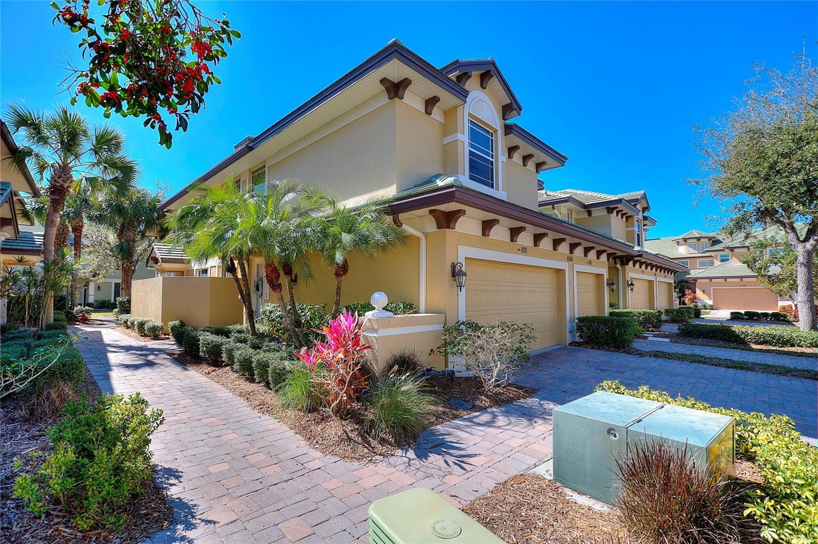 Location, location, location! Experience the lock-and-leave ease of luxury condo living in one of the most convenient and sought-after locations in Lakewood Ranch. Nestled within the highly desirable gated waterfront community of The Moorings at Edgewater, this beautifully updated 3-bedroom, 3-bath townhome offers the perfect blend of comfort, style, and resort-style living.
Thoughtfully renovated throughout, the home features a spacious open-concept layout designed for both everyday living and entertaining. You’ll love the beautiful flooring, updated lighting, and ceiling fans throughout, along with the light and bright kitchen offering generous counter space, abundant cabinetry, and seamless flow into the spacious living area. The living room showcases an elegant tray ceiling, custom lighting, and access to a private balcony.
The spacious primary suite offers direct lanai access and a peaceful retreat-like setting, while the split-bedroom floor plan provides privacy and flexibility for family and guests. One guest suite features its own ensuite bath and walk-in closet, while the third bedroom is generously sized and conveniently located next to the home’s third full bathroom.
Additional highlights include an upstairs laundry room, an attached 2-car garage with an electric car charger and ample storage. A newer roof was installed by the HOA approximately two years ago.
Residents of The Moorings enjoy an exceptional maintenance-free lifestyle with resort-style amenities, including a clubhouse, heated pool and spa, fitness center, indoor kitchen, and private boat club. Enjoy exclusive access to the private island on 168-acre Lake Uihlein, featuring walking paths, kayaking, canoeing, a fishing pier, gazebo, and breathtaking natural scenery filled with wildlife.
Best of all, this gated community offers walking access to Lakewood Ranch Main Street, where you’ll enjoy Music on Main nights, dining, shopping, miniature golf, movie nights, and more. Ideally located just minutes from Sarasota-Bradenton International Airport, I-75, Waterside Place, UTC Mall, Lakewood Ranch Medical Center, and the beautiful Gulf beaches, all within one of the nation’s most sought-after master-planned communities.