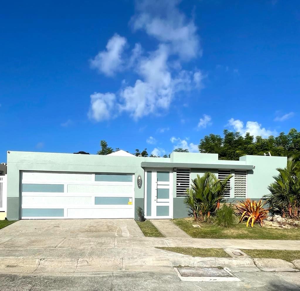 Back on the Market due to Financing! Location, location, location! Beautiful property with open floor plan near San Juan with 4 bedrooms, 2 bathrooms and 2 half bathrooms with controlled access and a 24-hour guard as well as tele entry and a private pool with no rear neighbors. The community has a small gym, swimming pool and basketball court. It is a great location, next to Route 66 with easy access to San Juan and Luquillo beach towards the eastern area of Puerto Rico, the airport is approximate only 23 minutes away. Restaurants and shops are very close including Belz Outlets, Burlington, Ralph Supermarket, Walmart, banks, movie theaters and much more.  The property has approximately 4,000 square feet of construction and an enclosed terrace with 4 ceiling fans and security windows and doors that leads to the pool. The property has air conditioners in each room and 2 in the kitchen area, family room and formal living room with high ceiling and another 3 ceiling fans. The house has a Generac gas generator and water tank. The laundry area has an area for a washer and dryer, a closet with a sink and another double closet for storage. Closed 2-car garage with electric doors. The property has security cameras around the property. Beautiful PVC cabinets in kitchen and master bathroom. All measures are approximate and if necessary can be verified by you. AIRBNB IS NOT ALLOWED.