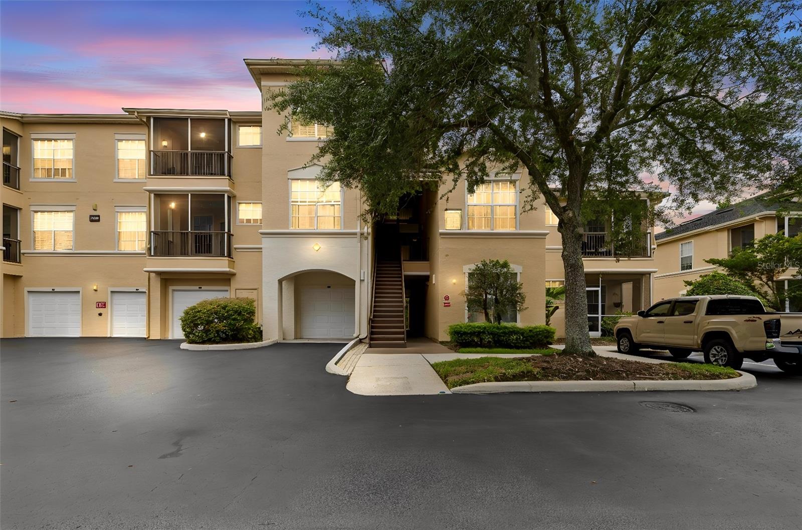 Awesome GROUND FLOOR 1 Bedroom Condo at Oxford Place in DESIRABLE TAMPA PALMS. RARE DEEDED GARAGE, this is the one you've waited for. From the garage a covered walkway takes you STEPS towards the entrance of the condo. Clean and immaculately kempt, this unit is TURN-KEY and ready for new owners to move in. Kitchen features wood cabinets, stone counters & nice appliances including DISHWASHER and over the range microwave. INDOOR LAUNDRY off the kitchen doubles as storage and pantry. The bedroom is a nice size and features a jack & jill bathroom with shower/tub and sizeable closets. Sliders from the living room leads out to a screened lanai looking out to CONSERVATION VIEWS. This is the perfect place to unwind and take in the indoor/outdoor lifestyle that defines Florida living. Community Pool, Clubhouse and a host of community amenities adds to the perks of living in this great neighborhood. Don't miss out and schedule your showing today