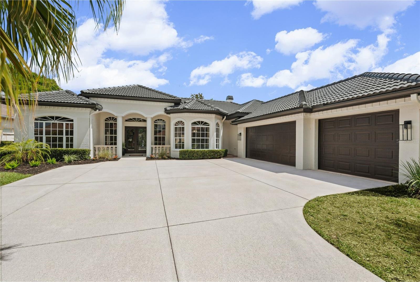 Completely reimagined by Abend Homes Inc., this luxury renovated pool home in the sought-after Eaton Park enclave of University Park Country Club blends elevated design, modern functionality and the ideal indoor-outdoor Florida lifestyle. Situated on a premium pond-view homesite, this extensively updated residence offers 3 bedrooms plus a den, open-concept living spaces and exceptional indoor-outdoor entertaining designed for both everyday living and hosting guests in style.

The designer kitchen serves as the centerpiece of the home featuring a large island, quartz countertops, double-stacked cabinetry and a premium KitchenAid appliance package including range, drawer microwave, refrigerator, dishwasher, washer and dryer. The open-concept floorplan flows seamlessly into the main living and dining spaces creating a bright and inviting atmosphere enhanced by engineered hardwood flooring, recessed lighting, designer fixtures and abundant natural light throughout.

A custom stack-stone entertainment wall with built-in cabinetry, floating shelves and electric fireplace anchors the main living area while multiple sliding doors create effortless transitions to the expansive lanai and pool area overlooking peaceful water views.

The luxurious primary suite has been transformed into a spa-inspired retreat with a freestanding soaking tub, oversized tiled shower, glass enclosure, dual vanity, designer lighting and custom closet system. Additional upgrades throughout the home include a renovated guest bath, new interior paint, upgraded baseboards, updated hardware, new window treatments, new HVAC system and new water heater.

Outdoor living is where this home truly shines. The extended screened lanai and resurfaced pool create the ultimate private retreat for relaxing, entertaining and enjoying year-round Florida living. Additional outdoor improvements include new waterline tile, new pool heater and pump, no-see-um screening, fresh exterior paint, updated landscaping, outdoor ceiling fans and tranquil water views.

Originally built by Bamboo Homes, this thoughtfully renovated residence also features a side-entry garage with dedicated golf cart/storage space and a tile roof replaced in 2019.

Located inside the gates of award-winning University Park Country Club, residents enjoy championship golf, tennis, pickleball, fitness, dining and an active social lifestyle just minutes from UTC shopping and dining, Lakewood Ranch, downtown Sarasota, SRQ Airport, top-rated Gulf Coast beaches and convenient access to I-75. University Park Country Club offers a variety of membership opportunities designed to fit different lifestyles and desired levels of club access and amenities.

Luxury renovation. Water views. Resort-style outdoor living. Move-in ready living in one of Sarasota’s most desirable golf and country club communities.