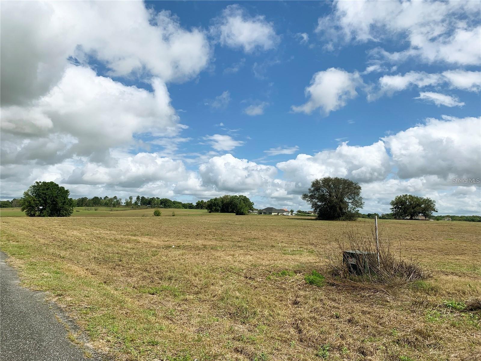 A rare find! Must see to believe! Won't last long! Everything you have dreamed of! Country Living in the Horse Capital of the World. Only minutes from the legendary World Equestrian Center (WEC). Congratulations your search ends here, if your search includes beautiful views, rolling hills, elevated views of unbelievable sunsets, great neighbors, in a country setting on your 3 acre mini farm with reasonable deed restrictions to protect your investment, such as 4 board fencing combined with private roads and underground utilities. Making this a unique opportunity and great investment. Better hurry, but not too fast, because you may encounter a cowboy or cowgirl horseback on the side of the road. Whether you are relocating within Florida or coming from another state, this is a must see!