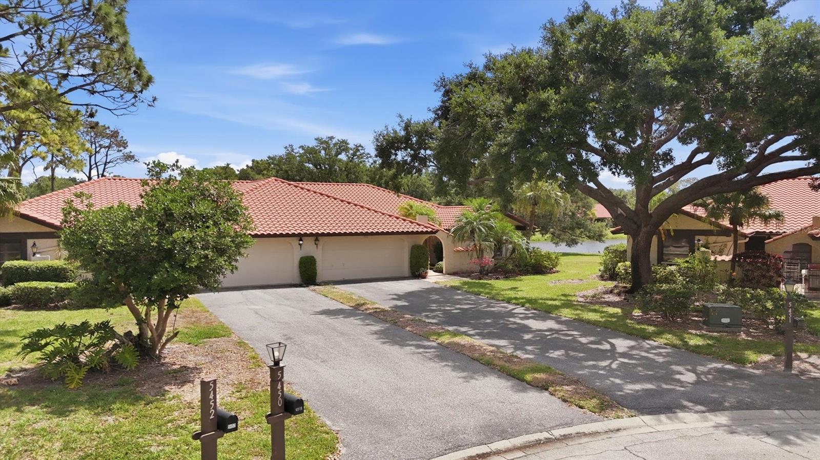 Nestled in the desirable 55+ community of Golf Pointe at Palm Aire Country Club in beautiful Sarasota, this well-maintained 2-bedroom, 2-bath home offers peaceful pond views and a thoughtfully designed floor plan perfect for comfortable Florida living. Located on a quiet cul-de-sac, the home features an eat-in kitchen with abundant cabinetry, pantry storage, and a convenient laundry closet.

The dining room showcases custom built-in cabinetry, while the spacious living room opens to an enclosed lanai with sliders overlooking the tranquil water views — an ideal setting for relaxing or entertaining. Flexible home office space with built in cabinetry, perfect for hobbies or remote work.

The primary suite includes a walk-in closet and en suite bath with a walk-in shower and pocket doors leading to the office flex space. The second bedroom features an oversized closet, with additional storage conveniently located in the hallway by the main bathroom. Outside, enjoy a private gated courtyard and a garage complete with built-in storage closets.

Residents enjoy maintenance-free living with fees that include ground maintenance, pest control, roof care, exterior maintenance, and basic cable. Conveniently located near shopping, dining, golf, UTC Mall, and Sarasota-Bradenton International Airport, this home is also just a short drive from the stunning Gulf beaches, including Siesta Key Beach and Lido Key Beach. Experience the best of Florida’s active lifestyle in this charming Palm Aire community home.