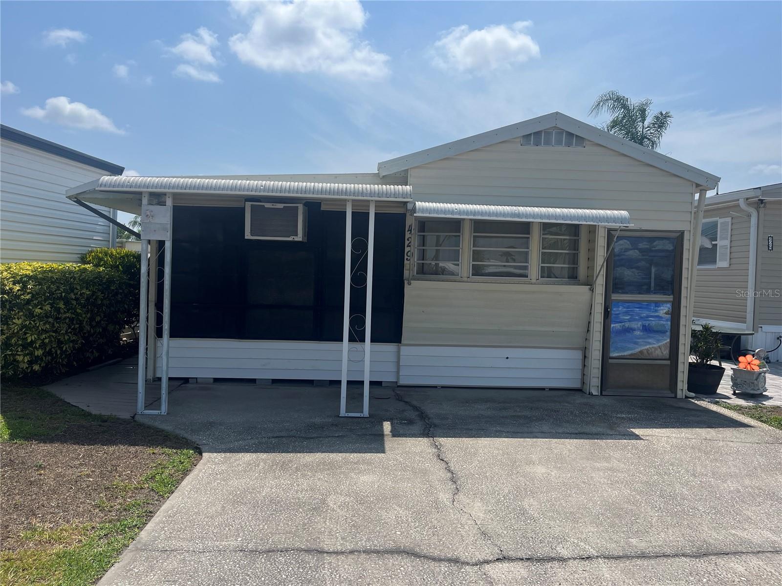 Wonderful opportunity to own your mobile home by the canal in the desirable Outdoor Resorts community!  This one-bedroom, one-bath home offers peaceful water views and the chance to unwind in a serene setting. Enjoy  relaxing evenings by the canal in a friendly, well-maintained community with great amenities. You will find a wonderful Cabinet bed for an extra sleeping option, along with a sofa bed in the living room-providing plenty of comfortable places to sleep. The sale includes all appliances and furniture, offering a convenient, fully furnished, move in ready. The HOA is $768.00 quarterly and includes: Water, Sewer Maintenance, Cable, Trash, Lawn care, 24Hr security, and resort -style amenities like two heated Pools, 9-hole golf, Tennis & Pickleball courts, and access to Lake Davenport for Boating and Fishing enthusiast. Best of all You Own the Land!