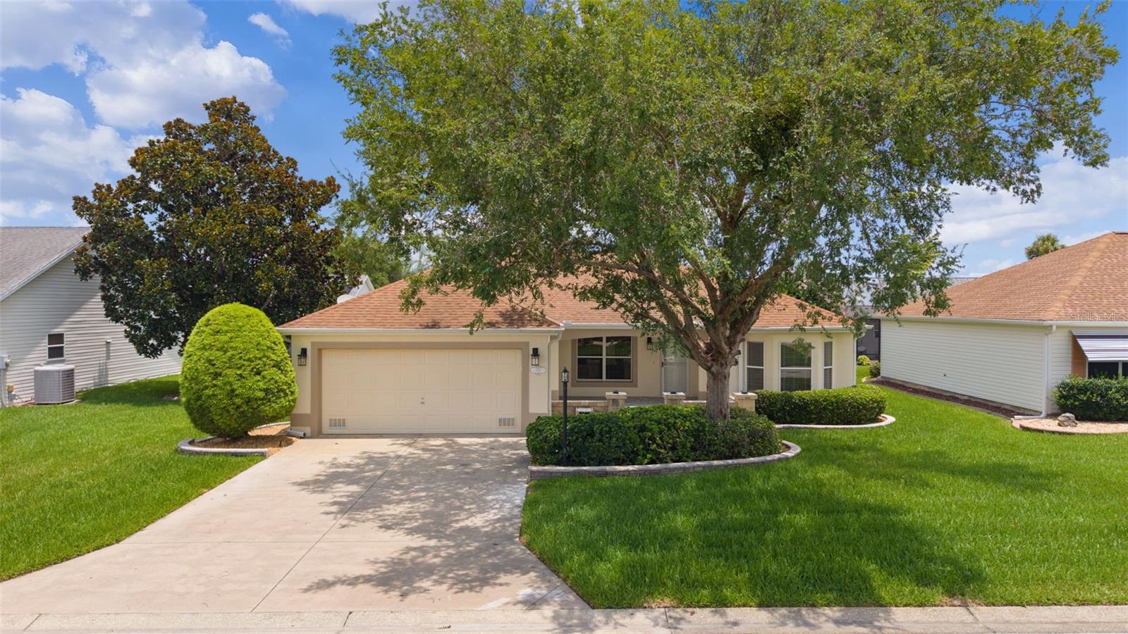 One or more photo(s) was virtually staged.

Welcome to this beautifully upgraded Designer Model Catalina home. This exceptional home has been thoughtfully updated with quality finishes, modern conveniences, and numerous improvements throughout, plus it has no bond. The home features a newer roof installed in 2017, a new hot water heater in 2023, and a new HVAC system installed in July 2026 with a 10-year parts and labor warranty for added peace of mind.

Step inside to discover a bright, inviting interior featuring waterproof laminate flooring with a residential lifetime warranty, elegant 5-inch baseboards throughout, and beautifully finished textured ceilings. The updated kitchen and bathrooms showcase stunning quartz countertops, 42-inch upper kitchen cabinets, and upgraded cabinetry with soft-close drawers and doors. The kitchen is complemented by newer stainless-steel appliances, while the home is enhanced with new light fixtures, ceiling fans, and newly installed combination CO/smoke detectors.

Enjoy additional living space with the spacious walled front patio measuring approximately 19’ x 16’ (304 sq. ft.) and the beautifully designed glass-enclosed lanai measuring approximately 14.5’ x 8.7’ (126 sq. ft.) under heating and air conditioning. The lanai features attractive newly installed tile flooring and includes a 10-year warranty for the windows, creating a comfortable year-round retreat.
The home also offers a well-appointed garage featuring a new industrial-grade Polycuramine floor coating, a convenient workbench with sink, pull-down attic stairs, and attic storage with all screens neatly stored. Additional highlights include inside laundry, two solar tubes providing natural light, and all new exterior hardscaping. With quality upgrades, stylish finishes, and exceptional attention to detail, this move-in-ready home offers the perfect blend of comfort, functionality, and peace of mind.