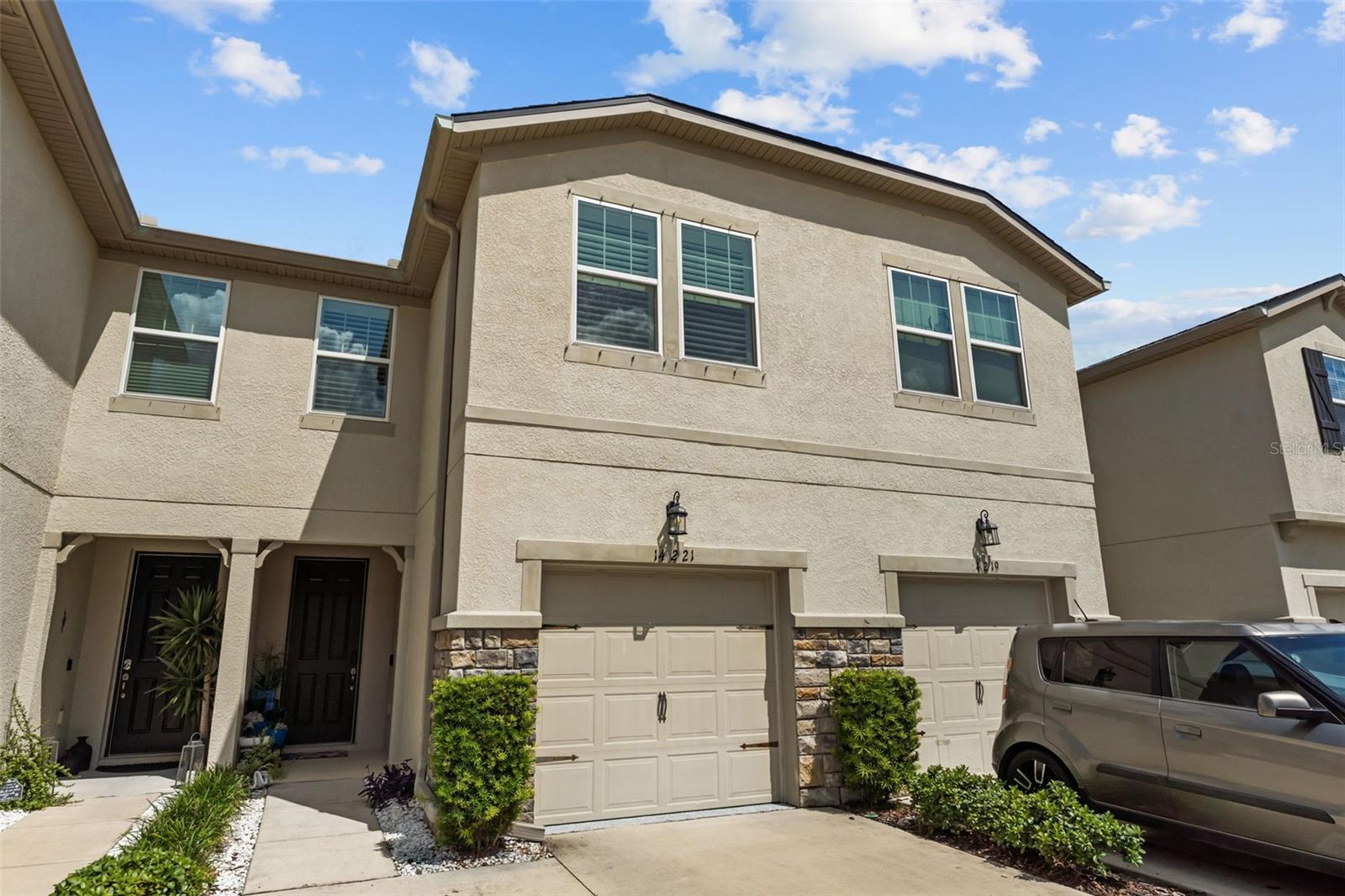 Supremely located 3 bed/2.5 bath newer townhome (2019) built by Mattamy Homes  in Tampa Bay, just a hop, skip and a jump off the very popular easy Veteran's Express AND  in the gated community of Lakeview at Citrus Park. Whether working from home or coming in from a long day at work, this home feels like a retreat with its calm, contemporary tones... beautiful grey cabinetry (42 inch!), crown molding and gorgeous huge granite kitchen island and countertops, all wood-look tile first floor. Kitchen is HEART of home (loads of counter space, coffee bar, mud room niche, separate pantry) and connects perfectly with the great room and screened patio, with lovely views of neighborhood courtyard and trees. Owner's suite offers two separate closets and owner's bath includes large double vanity with plenty of counter space AND another large walk-in closet. Open Bonus room (Versatile space, whether for home office or recreation) separates owner's suite from secondary bedrooms and full bath; plus upstairs laundry. Secondary bedrooms offer generous closet space and lovely natural light. Plantation shutters on upstairs windows. Hurricane shutters included for added wind protection. Lakeview at Citrus Park is a newer gated neighborhood that is conveniently located right off the Veteran's expressway and Ehrlich Road so commutes, whether to Downtown Tampa or Carrollwood or USF/Moffitt area are very reasonable. Showings are by appointment only, listing agent accompany.