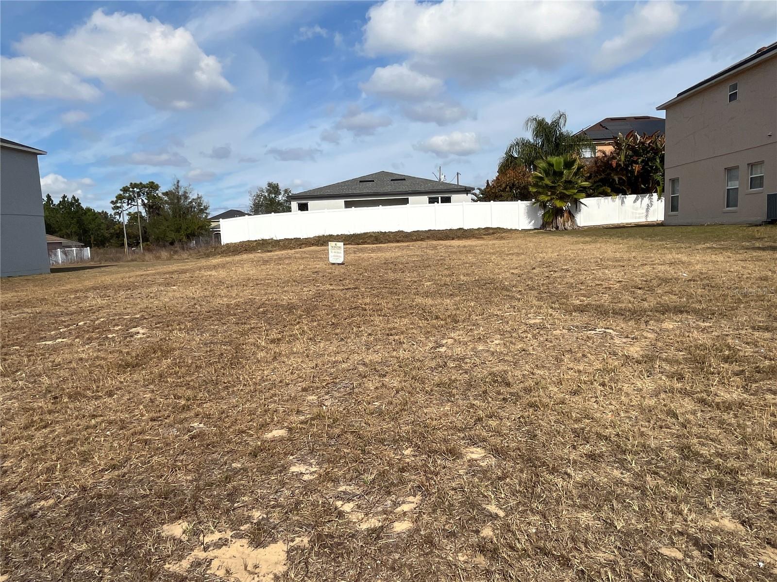 Reduced!!!  Need a Break from the Cold?  Close proximity Disney, Universal and other Major Theme Parks.  Build your Florida dream home on this cleared, buildable residential lot located at 2419 Rio Grande Valley Ct in Poinciana. Positioned on a street surrounded by established homes, this homesite offers a great blend of neighborhood setting and open space, ideal for a custom single-family build.  The lot is open and easy to walk, making it simple to envision your future home design, outdoor living area, and landscaping. Conveniently located near shopping, dining, schools, major roadways, with easy access to Central Florida attractions, Orlando airport, access to Amtrak and the Brightline train and so much more.  This is a solid opportunity whether you’re ready to build now or looking to secure land for the future.