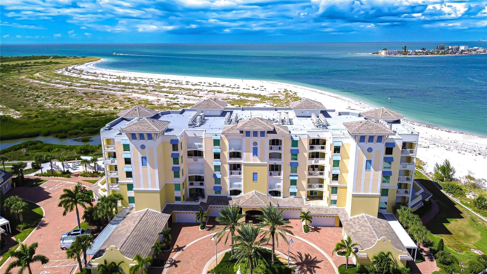 PENTHOUSE SIX- One of a kind.       Indulge in beach front luxury with unrivaled 360° Panoramic views!  
Welcome to the rare and magnificent end/corner penthouse condo offering 5,573 square feet of refined coastal living. This 4-bedroom 4.5-bathroom Penthouse is majestically perched on the shores of the Gulf and Tierra Verde Island. This exclusive gated residence serves you resort-style views in every direction and is the only home of its kind within this elite, gated waterfront community. Surrounded by  nature and serenity, the residence offers direct access to Shell Key Preserve, an 1,800-acre protected barrier island with a pristine natural beach. Enjoy long beach walks, kayaking, paddleboarding, and breath taking sunsets in this extraordinary sanctuary. As you arrive via semi private elevator to your grand private personal foyer, you're greeted by stunning artistic glass double doors that open into a light-filled open floor plan perfectly framing panoramic vistas of the Gulf, nature preserve, estuary, Don Cesar Hotel, and the downtown St. Petersburg skyline. Step onto the private boardwalk, and you’ll find yourself immersed between the Gulf of America and the untouched shores of Shell Key. Stroll for miles collecting rare shells, fossils, and shark teeth, or marvel at dolphins, manatees, sea turtles, and other local wildlife right from your balcony. Inside, the residence is a masterpiece of design and function: Four expansive ensuite bedrooms, offering ultimate privacy and comfort. Executive office, multiple-flex rooms, and cozy sitting area. The kitchen is a culinary dream with dual islands, top-of-the-line Sub zero and Wolf appliances, perfect for entertaining. A Luxurious primary suite with private gulf views, a spa inspired bath, dual vanities, walk-in expansive shower, and custom dressing room. Thoughtful, high end finishes are found throughout, including Impact-rated hurricane windows & doors (PG50, up to 157+ mph) Remote-controlled hurricane shutters on all sliders, Leak defense system for peace of mind, multiple private balconies offering unobstructed sunset views and amazing skies to the west and brilliant sunrises, Skyway bridge and Space Launches on the east. Amenities that rival a Resort: Sunset Pointe offers a secure, tranquil lifestyle with: geo-thermal heated pool and spa, fitness center, chip and putting green, bocce court, community room, nature trails, fire pits, private beach and access gated entry for privacy and security. Sports lovers will appreciate proximity to MLB, NHL, NFL, PSL, and IndyCar Racing, all within 20–40 minutes. Traveling is easy with three international airports just 25–60 minutes away. Parking includes 2 private air conditioned garages, plus an additional assigned space in the main garage. Located just minutes from downtown St. Petersburg, South Tampa, and the area's top dining, shopping, and art destinations, this residence offers the ultimate blend of luxury, privacy, and accessibility. Tierra Verde was named #1 beach in the world by trip advisor offering crystal clear waters and pristine nature preserved beaches. This is more than a home, it's a lifestyle. Experience this extraordinary penthouse and the very best of beach front living on Florida’s Gulf Coast. This property is located just 2 hours from Orlando, 4 hours from Miami and 3.5 hours from West Palm Beach. Call today to schedule your private showing.