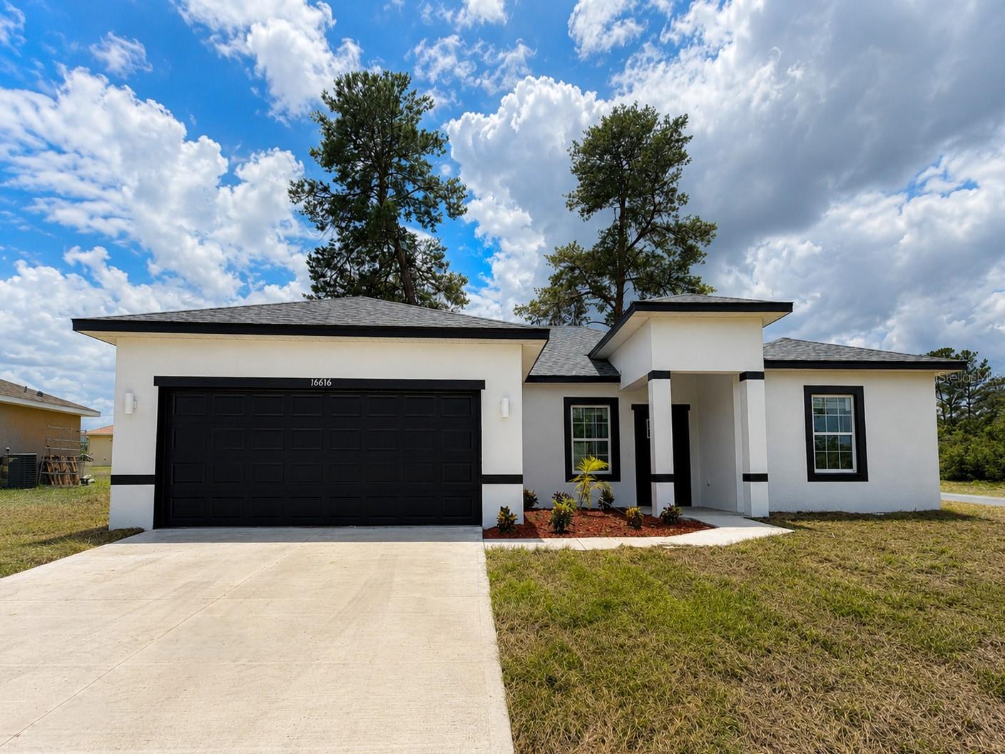 CORNER LOT. This beautifully designed Arpoador model features 4 spacious bedrooms, 3 full bathrooms, and 1,892 sq ft of heated living space, with a total construction area of 2,333 sq ft. The home is finished with SLEEK BRUSHED NICKEL FIXTURES AND ACCENTS, giving it a clean, modern aesthetic throughout. The open-concept kitchen is a showstopper with a WATERFALL QUARTZ ISLAND and comes fully equipped with stainless steel appliances—refrigerator, range, microwave, dishwasher, and disposal. The luxurious owner’s suite offers a STANDALONE TUB, glass-enclosed SHOWER DOOR, and dual vanities. Additional highlights include a SMART KEY entry system, double car garage, covered entry, and a 2-10 HOME WARRANTY for added peace of mind. Don’t miss this opportunity—schedule your private showing today!