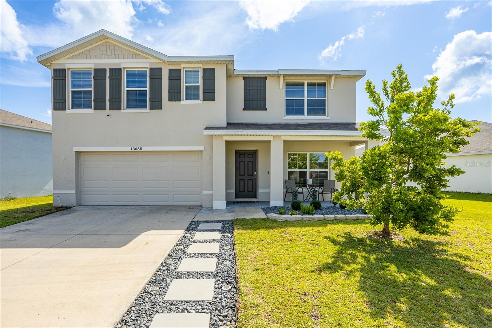 Nestled among the rolling hills of Dade City in the growing Heritage Hills community, this immaculate 2022 D.R. Horton Hayden model offers the perfect blend of modern comfort, thoughtful upgrades, and an unbeatable location! This all concrete block two-story home features 5 bedrooms, 3 full baths, approximately 2,605 square feet, and sits on one of the largest lots in the neighborhood at nearly a quarter acre with a fully fenced backyard.
Inside, you’ll love the bright and open layout filled with natural light, tons of storage, and stylish custom woodwork upgrades throughout. The spacious kitchen overlooks the living and dining areas, creating the ideal setup for entertaining and everyday living. Wood tile flooring flows throughout the main living areas downstairs, while the upstairs features comfortable carpeted bedrooms and a convenient second-floor laundry room. A downstairs bedroom and full bath provide flexibility for guests, multigenerational living, or a home office.
Step outside to enjoy the backyard patio overlooking one of the largest lots in the neighborhood. Fully fenced and offering endless possibilities, the expansive backyard provides plenty of room for entertaining, pets, play, gardening, or even adding a future pool — all with added privacy and space to truly make it your own.
Located directly across from John S. Burks Memorial Park, residents enjoy easy access to walking trails, sports fields, playgrounds, and wide open green space. Heritage Hills offers a peaceful, rural feel while remaining just minutes from Historic Downtown Dade City, known for its charming antique shops, boutiques, coffee shops, breweries, restaurants, art galleries, and local events. Nearby splash pads, parks, schools, shopping, dining, hospitals, and golf at Lake Jovita add even more convenience and recreation. With easy access to SR-52, commuting to Wesley Chapel, Tampa, and Tampa International Airport is a breeze.
Low HOA fees of just $76/month and NO CDD make this home even more attractive. Community amenities include a neighborhood park and playground. Don’t miss your opportunity to own this exceptional home in one of Dade City’s most desirable communities — schedule your private tour today!