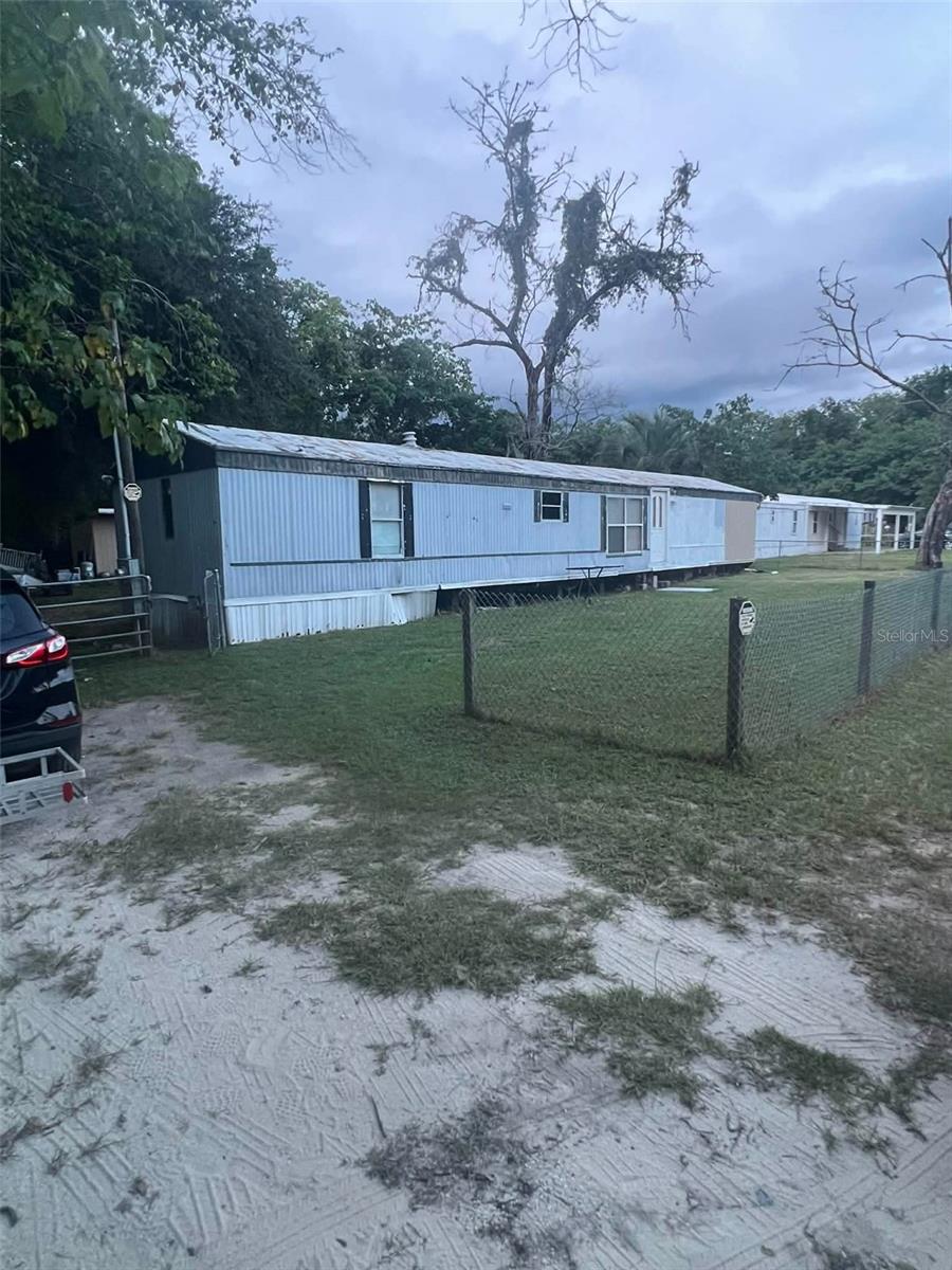 Opportunity awaits with this 3-bedroom, 2-bath manufactured home situated on its own 0.23-acre lot in Belleview! Offering 904 square feet of living space, this property is ideal for investors, flippers, or buyers looking to add their personal touch. Enjoy the benefits of no HOA and no lot rent, with plenty of room for outdoor activities, parking, or future improvements. The fenced yard provides added privacy, while mature trees give shade and character. Conveniently located near Belleview, Lake Weir, shopping, dining, and major roadways, this property combines country living with everyday convenience. Bring your vision and unlock the potential of this affordable Marion County property!  Roof needs replaced, AC duct system is newer and well water. Water heater works great! Come see what this home has to give with an open mind.