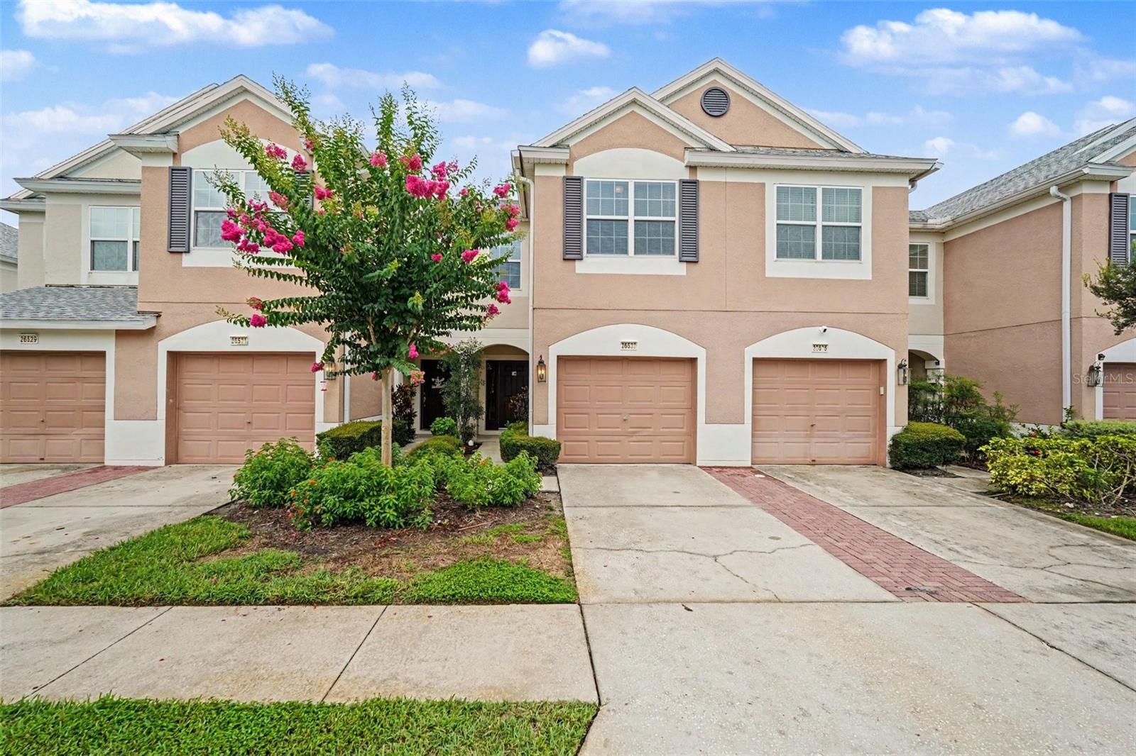 This 3-bedroom, 2.5-bathroom home offers a perfect blend of comfort and versatile living space, complete with a one-car garage in the Bay At Cypress Creek neighborhood. 
Inside, this Southwest-facing home features a spacious open floor plan that seamlessly connects the main living areas. The interior layout creates a seamless and airy feel, highlighted by beautiful tile and hardwood flooring throughout the primary floor with carpet in the second floor. The functional kitchen overlooks the living space, which then looks out that backyard through the screened-in patio. The primary suite offers a private and comfortable space, complete with an attached bathroom. Enjoy low-maintenance living with fantastic community amenities. This prime location is conveniently close to shopping, dining, entertainment, and major highways, offering an easy commute.