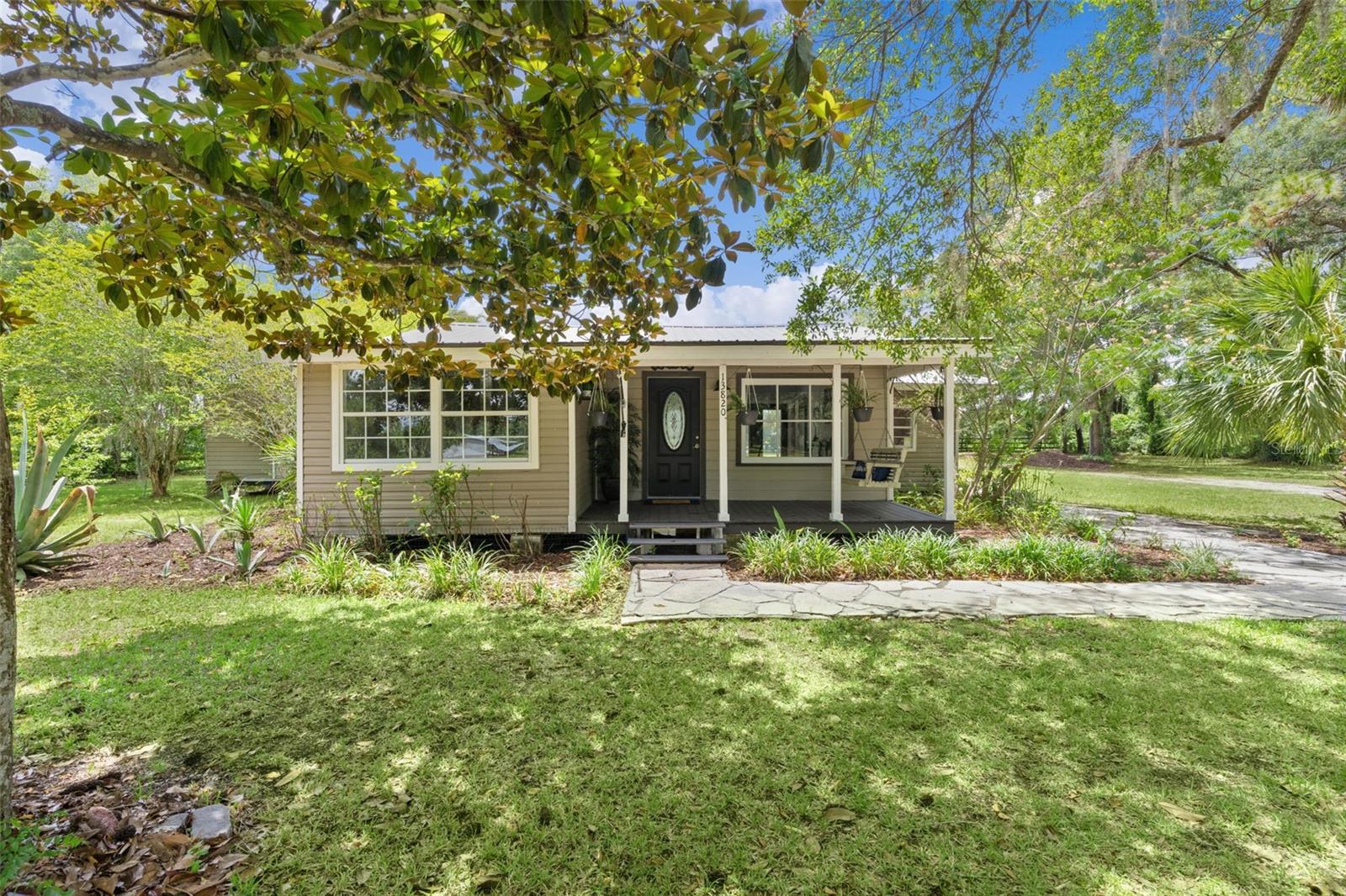 Rare chance to own 2 parcels being sold together (1.38 acre)- One featuring a residential home and the other offering vacant land full of potential.
Step into timeless charm with this adorable 1963 home, beautifully updated while preserving the classic character. Featuring sturdy cedar framing, this home has been thoughtfully renovated inside and out, including durable vinyl siding and stylish luxury vinyl flooring throughout. Enjoy peaceful mornings and relaxing evenings on the inviting front porch complete with a swing, or host family and friends on the spacious back porch designed for gatherings and good times. Weather you're looking for  a cozy retreat or a place to create lasting memories, this charming home is ready to welcome you. ROOF-METAL- 2016   HOT WATER TANK- 2014  AC-2016 SELL$6000.00 IN CONCESSIONS!!!