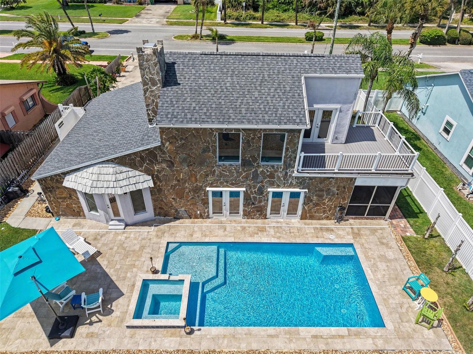 Experience the ultimate coastal lifestyle in this beachside retreat just steps from the sand. Designed for both relaxation and entertaining, this property features a private pool with hot tub, and an oasis-inspired backyard that feels like your own personal resort. Start your mornings on the expansive second-story deck taking in breathtaking sunrises, then end your evenings with sunset beach walks and rocket launches lighting up the sky. Inside, the home blends charm and flexibility with gorgeously renovated bathrooms, impact-rated windows and doors, newer HVAC and water heater, and a newer roof for peace of mind. A unique layout offers the option for a primary suite upstairs or downstairs, while the upstairs bedrooms can be accessed by a stunning interior spiral staircase or a private exterior staircase leading directly to the ocean-view deck.

After a day at the beach, rinse off in the outdoor shower that conveniently connects to the primary ensuite. Enjoy coastal breezes year-round from the screened side porch, perfect for morning coffee or evening cocktails. Located close to restaurants, shopping, attractions, and entertainment, this home offers the perfect blend of everyday luxury and laid-back beach living.

Whether you're searching for a full-time coastal residence, weekend getaway, or an exceptional income-producing opportunity, this property could make an ideal vacation rental with its unbeatable location, resort-style outdoor space, flexible layout, and true Florida lifestyle appeal. Furnishings are negotiable, making this an even easier transition into your own turnkey beach retreat or vacation rental investment. This is more than a home--it's a lifestyle choice where every day feels like a vacation and the beach is just feet away.
All updates renovations completed 2021 and after.
