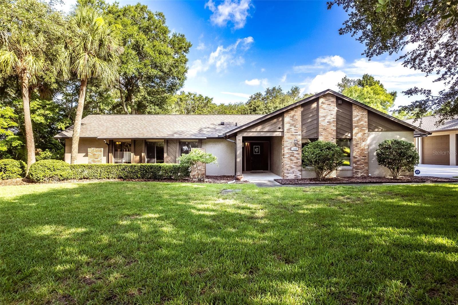 Situated on more than 1 ACRE in Longwood's desirable Mandarin community with no HOA, this 5-bedroom, 3-bath pool home offers approximately 2,700 square feet of living space along with a detached 16 CAR air-conditioned garage, perfect for any automotive enthusiast. Inside, you'll find a spacious floor plan designed for comfortable everyday living. Tile flooring flows throughout the main living areas, while the kitchen serves as the heart of the home with granite countertops, upgraded wood cabinetry, abundant workspace, and generous bar seating. The kitchen opens seamlessly to the family room, where a wood-burning brick fireplace creates a warm gathering space for family and friends. The primary suite provides direct access to the patio through glass doors and features dual walk-in closets, dual vanities, and a spacious en-suite bath. Four additional bedrooms providing flexibility for guests, a home office, fitness space, or multi-generational living. Step outside and enjoy your own private retreat featuring an oversized recently resurfaced swimming pool surrounded by an expansive paver deck. The property also includes a storage shed with a newer roof and a well for irrigation, helping maintain the grounds efficiently. 
What truly sets this property apart is the incredible detached, air-conditioned garage capable of accommodating up to 16 vehicles. Built for serious collectors, hobbyists, RV owners, or business owners, the structure features 12-foot ceilings, 8-inch reinforced concrete with rebar, and exceptional versatility. The driveway and RV pad were also completely rebuilt with 6-inch reinforced concrete and rebar for long-term durability. The detached garage also provides unique opportunity to generate supplemental income by renting storage space to other vehicle collectors in need of secure, covered storage. A newer 2022 roof adds peace of mind, Solar Shield throughout the Attic to assist with energy efficiency. This home is within easy reach of everything Central Florida has to offer. Enjoy a short drive to the Lake Mary business corridor, Downtown Orlando, world-renowned theme parks, and the area's beautiful Atlantic coast beaches, along with access to Seminole County's top-rated schools. Whether you're searching for room to grow, space for a vehicle collection, income-producing potential, or simply the freedom that comes with owning over an acre without HOA restrictions, this is a property that offers possibilities rarely found in today's market.
