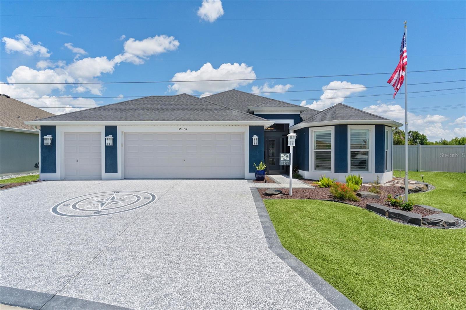 ~2022 ROOF, HVAC, & TANKLESS HOT WATER HEATER~ ~SALTWATER POOL~ ~HOT SPRINGS HOT TUB~ ~PRESERVE / WATER VIEW~ ~GOLF CART GARAGE~ ~NO CARPET~ ~TURNKEY PACKAGE AVAILABLE~ 
Experience luxury waterfront living in this stunning HILLSDALE (Mossy Oak) VERANDA in the highly sought-after Village of ST JOHNS, perfectly positioned to capture breathtaking water and preserve views of Lake Okahumpka. Offering exceptional upgrades, resort-style outdoor living, and premium finishes throughout, this 3/3 home is truly a rare find. Outstanding curb appeal begins with a PAINTED DRIVEWAY, elegant LEADED GLASS front door, and an oversized 2-car garage with GOLF CART GARAGE featuring EPOXY flooring, abundant storage, and an EV wall charger—perfect for modern convenience. Step inside to soaring HIGH VAULTED ceilings and beautiful PORCELAIN tile flooring throughout the entire home, creating a seamless blend of elegance and easy maintenance. The spacious living room is bright and inviting with high ceilings and a ceiling fan, while the formal dining area offers a refined space for entertaining. The gourmet kitchen is designed to impress with QUARTZ countertops, a stylish TILE BACKSPLASH, rollout cabinetry, GAS cooking, and a large BREAKFAST BAR accented by 3 pendant lights—ideal for casual dining and gathering with guests. The luxurious primary suite features TRAY CEILINGS, a ceiling fan, and an OVERSIZED WALK-IN closet. The spa-inspired ensuite bath boasts a TILED ROMAN SHOWER, DUAL SINKS, elevated QUARTZ countertops, and a separate commode area. Guest accommodation is equally impressive. The 2nd bedroom features PLANTATION SHUTTERS, tray ceilings, a ceiling fan, and a built-in closet. The adjacent guest bath offers a TILED tub/shower combination with FRAMELESS GLASS DOORS, linen closet, and elevated QUARTZ countertops. The 3rd bedroom includes high vaulted ceilings, a ceiling fan, and WALK-IN CLOSET, while the 3rd full bath features a TILED WALK-IN shower and QUARTZ countertops. The INSIDE LAUNDRY ROOM continues the home’s upscale finishes with a laundry tub, built-in cabinetry, and GE PROFILE appliances. Step outside into your private backyard paradise, where the spectacular outdoor living space is designed for year-round enjoyment. The expansive lanai features telescoping sliders, blinds, 2 ceiling fans, and beautiful textured painted flooring, all opening to a stunning HEATED SALTWATER POOL with FOUNTAINS and HOT SPRINGS HOT TUB. A full PAVER WALKWAY wraps around the home, enhancing both beauty and functionality while framing the incredible PANORAMIC LAKE and PRESERVE VIEWS. There is also a “Travel Package” available together or separately which includes a 2022 EZGO Electric Golf Cart and 2 Aventon e-bikes. This exceptional Hillsdale offers the perfect combination of luxury, comfort, and breathtaking scenery, an extraordinary opportunity to enjoy resort-style living in The Villages. St Johns is located just south of Brownwood with the north entrance right at the Okahumpka Rec Center which hosts kayaking and several pristine walkways including great birdwatching. Also close to Water Lily Family Pool & Rec Center, Pitch & Putt courses, executive golf courses, several swimming pools plus Edna's on the Green, Sawgrass Grove and Southern Oaks Championship Golf Course are nearby. Shopping and dining can be found at the Magnolia Plaza. The popular restaurant Harry & the Natives is also right up the road.