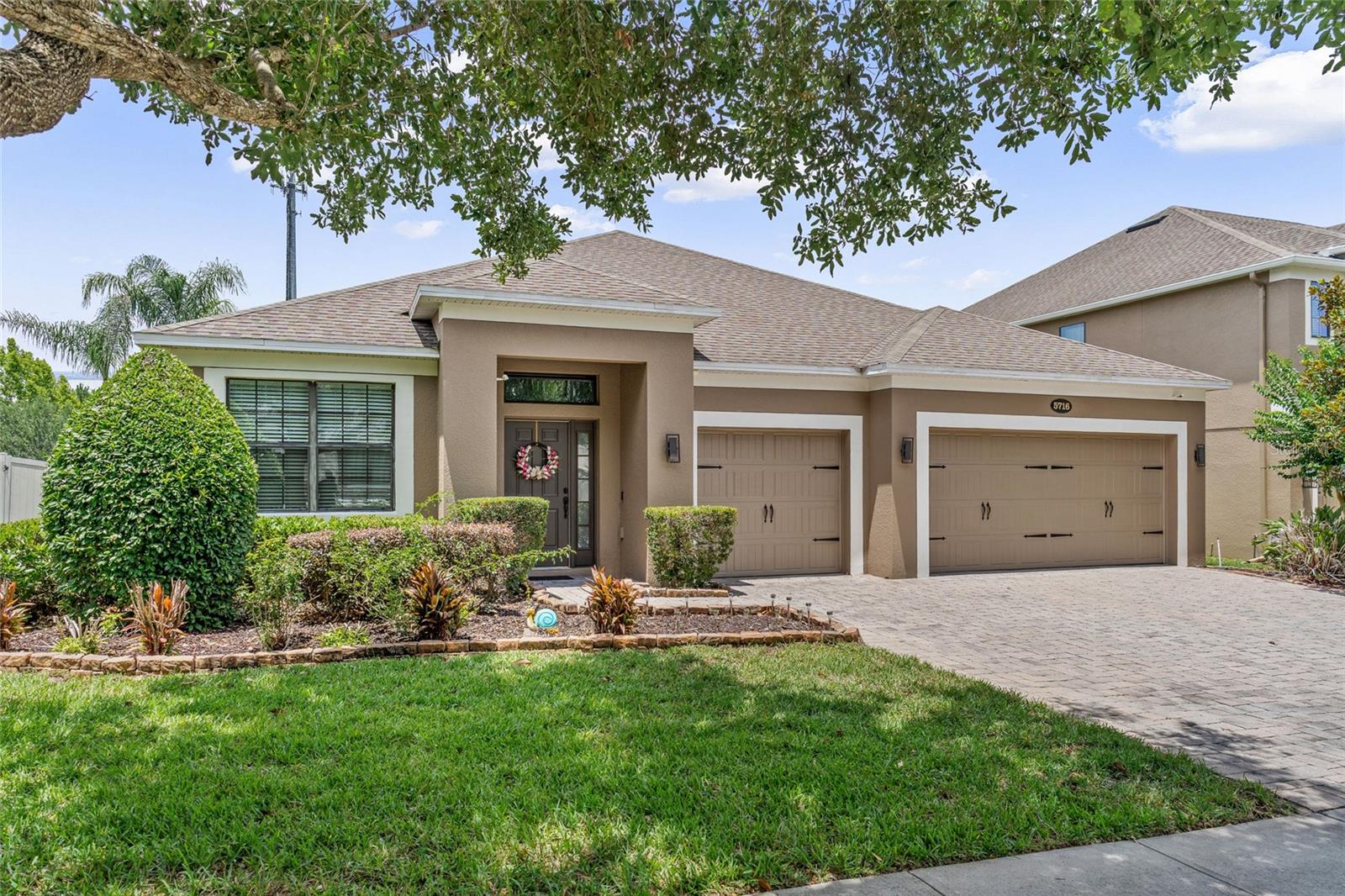 Step into modern comfort and style in this beautifully maintained home located in the desirable gated community of Versailles in Sanford, FL. Offering 4 bedrooms, 2.5 bathrooms, and 2,290 sq ft, this residence blends thoughtful upgrades with elegant design. The moment you enter, you’ll notice the high crown molded ceilings that elevate the home’s spacious, open feel. In 2024, all bedrooms received brand new carpeting, and argon filled double pane glass inserts were installed for enhanced insulation and energy efficiency—bringing a fresh, updated look throughout. Perfect for modern living, the home includes an electric vehicle adapter in the oversized 3 car garage.
The primary suite is privately situated in a split layout and serves as a serene retreat. Enjoy a luxurious en-suite bathroom featuring a deep soaking tub, separate shower, and a generous walk-in closet. A sparkling chandelier adds a touch of glamour and warmth to the primary bedroom.  Convenience is unmatched—just 7 minutes to I-4, 14 minutes to the restaurants and cafés of Historic Downtown Sanford, and 18 minutes to Sanford International Airport. This location offers the perfect balance of accessibility and tranquility. Don’t miss your chance to make this modern sanctuary your next home.