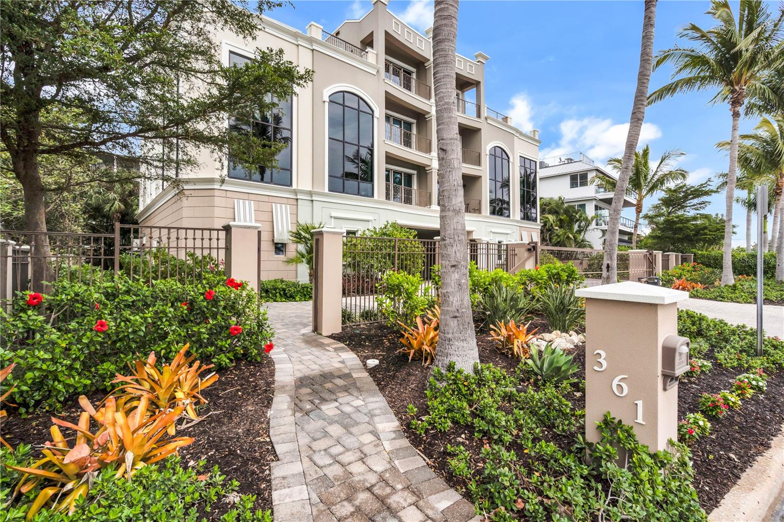 One or more photo(s) has been virtually staged. Welcome to the Exquisite Estate of Palazzi Al Mare. This breathtaking 5-bedrooms, 4 full baths, 2 half baths, 5-car garage home is the TROPHY of Gulf-front luxury with unobstructed ocean views from every level located directly in the heart of Lido Key & St. Armands Circle!