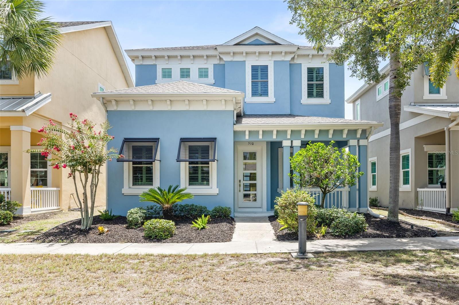 Virtually Staged. Welcome to this stunning 5-bedroom, 4-bathroom BayBreeze home in the highly sought-after MiraBay community, where luxury, comfort, and low-maintenance living come together. From the moment you enter, you'll be impressed by the soaring 12-foot ceilings, rich wood flooring accented with custom tile medallions, plantation shutters throughout, elegant crown molding, and an expansive paver lanai designed for effortless indoor-outdoor living.
The gourmet chef's kitchen is the heart of the home, featuring 42-inch cabinetry, granite countertops, an oversized center island, stainless steel appliances, a gas cooktop, separate wall oven, and a spacious pantry—perfect for entertaining or everyday living.  The separate laundry room includes a newer washer and dryer (2023).
The thoughtfully designed floor plan offers a luxurious primary suite on the main level with a spa-inspired ensuite bath with separate sinks and dual custom walk-in closets. A second main-floor bedroom with a custom closet and a full guest bath provide ideal accommodations for visitors or multigenerational living. Upstairs, you'll find two additional spacious bedrooms and another full bathroom.
Recent updates provide exceptional peace of mind, including a new roof (2026) with a transferable warranty, fresh interior paint (2026), exterior paint (2021), and hurricane-impact windows throughout the second floor, front and rear entry doors, plus additional impact windows in the front dining room.
Step outside to enjoy the screened, paver lanai complete with an outdoor TV, along with an extended paver patio that's already wired and plumbed for a future private pool and spa.
Adding incredible versatility is the 3-car garage and detached Carriage House, featuring luxury vinyl flooring throughout, a spacious living area, an updated modern bathroom with a tankless water heater, and a private bedroom with a large closet. Whether used as a guest suite, home office, in-law retreat, or private studio, this space offers endless possibilities.
BayBreeze residents enjoy low maintenance living with HOA services that include lawn and landscape, irrigation, and water, allowing you more time to enjoy the exceptional MiraBay lifestyle and its resort-style amenities including tennis, pickleball, basketball, a fitness center, clubhouse and cafe, water sports, walking trails, parks, playgrounds, and two pools.  Some photos have been virtually staged.  Schedule your showing today!