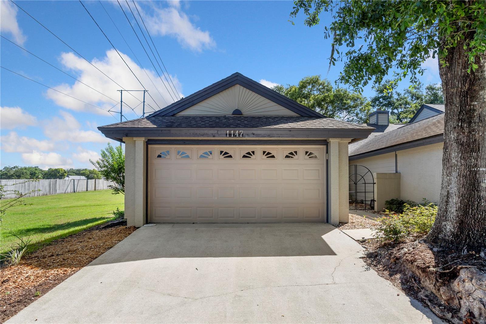 Looking for privacy? Here it is in the sought-after Country Creek Estates. Tucked away at the end of a quiet cul-de-sac, this lovely one-story townhome offers a peaceful setting with private gated access to the Seminole Trail, gate key included. This adorable two-bedroom, two-bath home features an air-conditioned sunroom, a two-car garage and thoughtful updates throughout, including a new HVAC system in 2025, a roof in 2019, exterior light fixtures in 2026 and a replaced front screen door in 2026. Enter inside and feel instantly wrapped in warmth and comfort. Fresh interior paint, including the baseboards, creates a clean and inviting feel, while new ceiling fans in the primary suite and living area add style and function. The chef's kitchen is beautifully appointed with high-end appliances, custom cabinetry and wine refrigeration, making it elegant and practical.