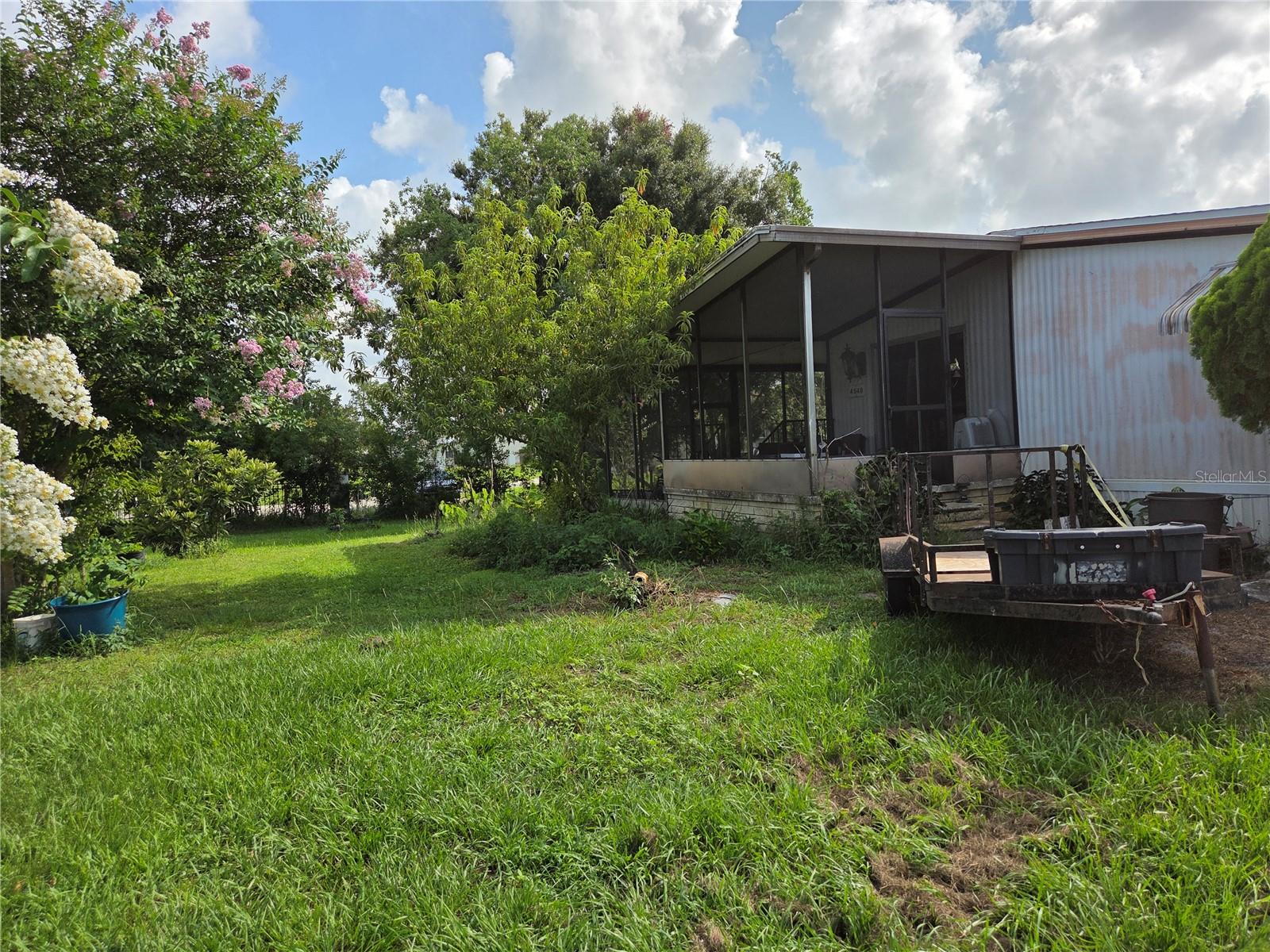 Manufactured double wide on 1 acre lot.  Fenced yard, no deed restrictions. This 2 bedroom 2 bath home has an extra great room that is 11.5X23.5 for added space. Roof was replaced in 2016. This is country living but close to shopping and the mall. There are 3 sheds on the property for lots of storage.