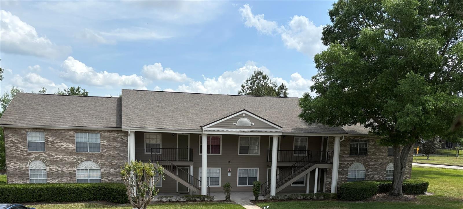 This is an end unit in this conveniently located condo in the UCF area.  This is a two bedroom, 2 bath condo with spacious living dining area and full kitchen and washer dryer unit.  Freshly painted and all new flooring throughout (except the bathrooms, they are tiled).  Community has tennis court, basketball court, swimming pool and clubhouse.  Walking distance to campus.