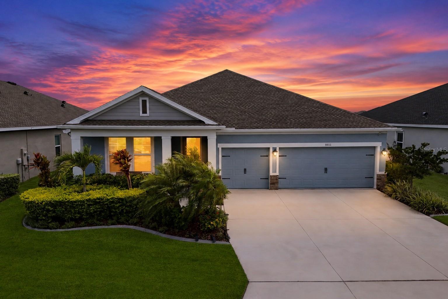 **Assumable 3.3% VA Loan available** Welcome to this stunning, better-than-new 4-bedroom plus study, 3-bath upgraded home in beautiful Isles at BayView. Set on a picturesque pond lot enhanced with tropical landscaping & decorative curbing, this craftsman style home features a wide 3-car driveway and an inviting front porch with custom pavers. An 8-foot glass front door opens to a bright entryway and an airy, triple-split floor plan designed for comfort & functionality. Off the entry, two generously sized bedrooms share a well-appointed full bath, while just beyond, a spacious flex room with French doors offers the perfect space for a home office, home gym, den, or media room. Across, the open concept kitchen overlooks a large Gathering Room. Your beautifully appointed gourmet kitchen is thoughtfully designed with 42" cabinetry topped w/crown molding, quartz counters, cooktop w/stainless hood, deep single-bowl stainless sink, subway tile backsplash, & corner pantry. Stainless Whirlpool appliances, including a double wall oven, make cooking a pleasure in this modern culinary space. Adjacent to the Gathering Room, the Dining Room effortlessly shifts from a cozy bonus lounge to the ultimate spot for more formal entertaining. Cozy up for movie night in the Gathering Room with your BEAUTIFUL, CUSTOM built-in entertainment center, mantle, & fireplace. A clever hidden drawer is built right into the mantle, perfectly designed to tuck away remotes & keep your stunning focal point clutter-free! Triple sliders open to your private screened lanai, fully equipped with premium 20/20 No-See-Um mesh screens & stylish paver flooring. Step out onto your extended custom pavered patio & soak in the incredible views of the serene pond & conservation backdrop. Flanked by tropical palms, this lush, private backyard sanctuary is perfect for soaking up the Florida sun & even offers room for a future pool! Back inside, the Primary Suite is a peaceful retreat with triple windows showcasing sweeping pond views. The spa-inspired en-suite bath features a floor-to-ceiling tiled walk-in Super Shower, extended quartz vanity w/dual sinks, private water closet, & massive walk-in closet with custom-built ins to neatly organize all of your clothing & accessories. Off the Dining Room, the 4th bedroom functions as a private Guest Suite with its own en-suite bath. Conveniently located off the main hallway, the laundry room features a handy drop zone area just outside & comes complete with a matching Samsung top-loading washer & dryer. Additional notable upgrades include Ring video cameras in front & back of home; Dual MyQ garage door openers; Smart Resideo enabled thermostat; Keyless front door digital lock; Motion sensor lighting; Whole home Titan water filtration system; Custom window treatments throughout; Motorized Remote slider blinds; Custom built-in closets throughout; Whole home gutters; Ceiling fans; Hurricane shutters; Insulated garage w/gym floors/insulated doors/added insulation in attic above garage; Overhead storage racks in garage & more. Situated in highly desirable Isles at BayView, this master planned community's layout is ideal for the outdoor lifestyle with amenities including a resort-style pool, clubhouse w/game room, dog park, scenic walking paths, and playground. Just minutes from world-class shopping, dining, entertainment, and Gulf Coast beaches, with quick & easy access to I-75 and the Sunshine Skyway.