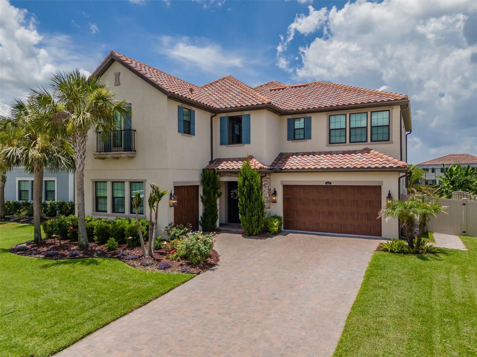 Welcome to your new home. In this stunning Estancia at Wiregrass Ranch Estate home in the highly coveted Revello section, serene water views, a sparkling pool, and a private owner’s balcony come together to create an exceptional lifestyle. Set on a premium pond-front homesite near the end of a quiet cul-de-sac in Estancia’s exclusive gated enclave, this remarkable residence offers privacy, elegance, and resort-style living today’s discerning buyers seek. 
Your entry into this stunning home begins with frosted glass double entry doors that open to a dramatic foyer highlighted by a stunning designer chandelier and beautiful luxury design throughout. Just off the entry is a separate private executive office with French doors providing an ideal work-from-home environment, while the formal dining room creates an elegant setting for dinner parties, family gatherings and memorable occasions. 
The gourmet kitchen is designed for both entertaining and everyday living, featuring an oversized island, gas cooktop, double wall ovens, dedicated coffee and beverage station, walk-in pantry, eat in dining space and abundant cabinetry. The kitchen opens seamlessly to the very spacious family room, anchored by a warm and inviting centerpiece fireplace and triple sliding glass doors that showcase the stunning pool and pond views.
Upstairs, there is a large bonus room, perfect for a media room, fitness center or anything that fits your lifestyle. While the luxurious owner's retreat suite features a private balcony for enjoying morning coffee or sunset views overlooking the water there is also a massive walk-in closet, spa-inspired bath with dual vanities, soaking tub, oversized walk thru shower with dual showerheads, and a sitting alcove. Three generous sized additional bedrooms, three full baths, and a well-appointed laundry room with sink, folding counter, and extensive upper and lower cabinetry complete the second floor.
Downstairs you will find a tucked away separate guest bedroom and a full bathroom perfect for visiting guests or multigenerational living
Step outside to your private backyard featuring an inviting poolside oasis with a refreshing oversized saltwater pool framed by a travertine deck that exudes timeless elegance and natural warmth, a fully fenced yard, and serene pond views—just in time to enjoy this summer and perfect for relaxing or entertaining year-round. SHOWCASING OVER $169,000 IN PREMIUM UPGRADES, every detail of this home has been thoughtfully curated to elevate both its beauty and functionality. 
Residents of Estancia enjoy a resort-style lifestyle with a beautifully appointed community clubhouse, theme park-inspired pool, fitness center, tennis/pickleball courts, walking trails, parks, and a vibrant calendar of social events and activities. Conveniently located near premier shopping, dining, top-rated schools, medical facilities, and major highways, this exceptional home offers luxury living in one of Wesley Chapel's most sought-after communities. Don’t miss this exceptional pool residence with its 5 bedrooms + 4 full baths + Separate Office + Separate Bonus room. So meticulous and pristine, homes this nice do not last long, schedule your private tour today. Don’t forget to ask about lender incentives also available for this home.