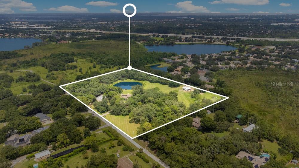 Welcome to “Home Again Ranch,” your extraordinary 12+ acre farm that is around the corner from Windermere and tucked away on a quiet cul-de-sac road. You don’t need to drive hours to experience country living at its finest. This is a once in a lifetime opportunity to own a large parcel of land zoned agricultural with NO HOA in the heart of one of Central Florida’s most desirable residential areas. The charming main residence has close to 4,000 square feet under air, and includes 5 bedrooms, 4 bathrooms, bonus room, an attached two car garage, 75’ porch overlooking your private pond with dock, and a swimming pool. There is an air-conditioned steel building for your equipment, storage, or extra living space. Horses and livestock can be housed comfortably in their own barn and graze in the corrals. Bring your vision to life whether it be farming, equestrian, or just wanting a great sense of privacy away from the hustle and bustle. The residence is zoned for Lake Whitney Elementary and Sunridge Middle School which are “A” rated schools. Location can’t be beat. Just 20 minutes to Disney World & Universal Studios, 5 minutes to Downtown Windermere, 10 minutes to historic downtown Winter Garden, and 30 minutes to Orlando International Airport. Don’t miss out on this incredible life-changing residence!