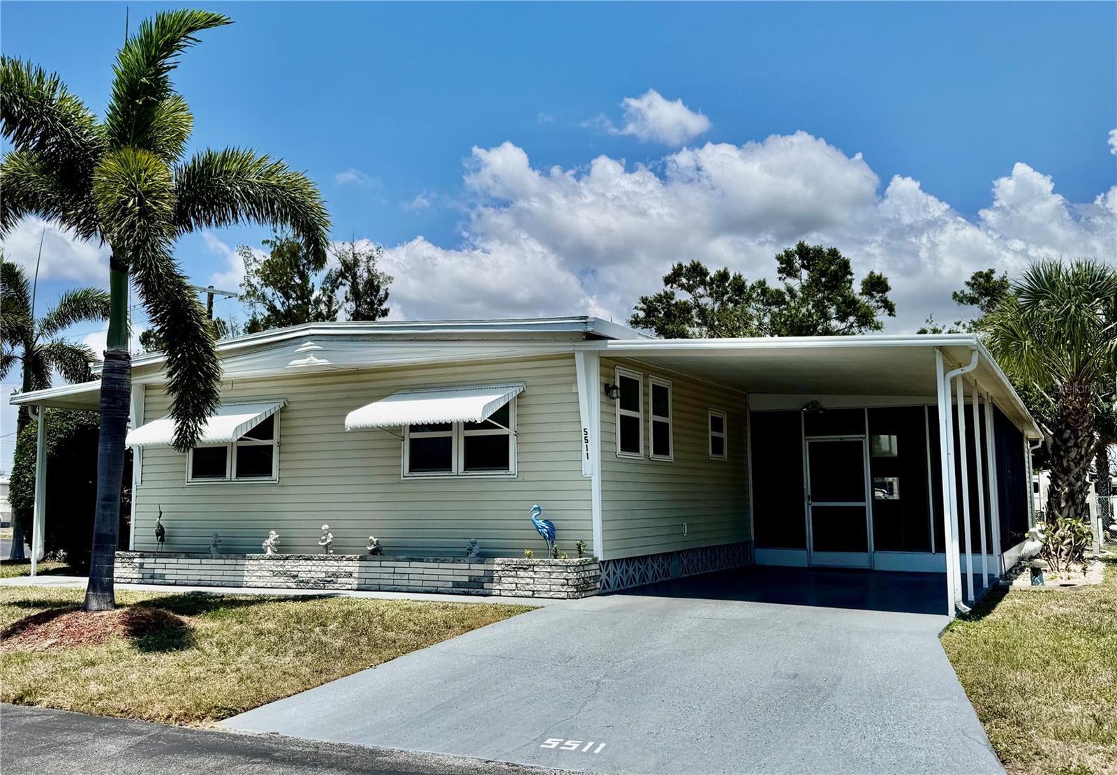 Charming and well-maintained DOUBLE-WIDE in sought-after 55+ Chateau Village—where you OWN your land! This furnished 2 bed, 2 bath home offers TWO covered carports and TWO lanais, perfect for enjoying the Florida lifestyle. Recent updates include new plumbing and drains (2023), water heater (2023), updated electrical panel (2024), and new carpet in the front lanai.

Enjoy low HOA fees of just $210/month covering water, trash, cable, and internet. This active, pet-friendly community features a pool, clubhouse, and shuffleboard, all just minutes from shopping, dining, and the Gulf beaches. Move-in ready and easy to show!