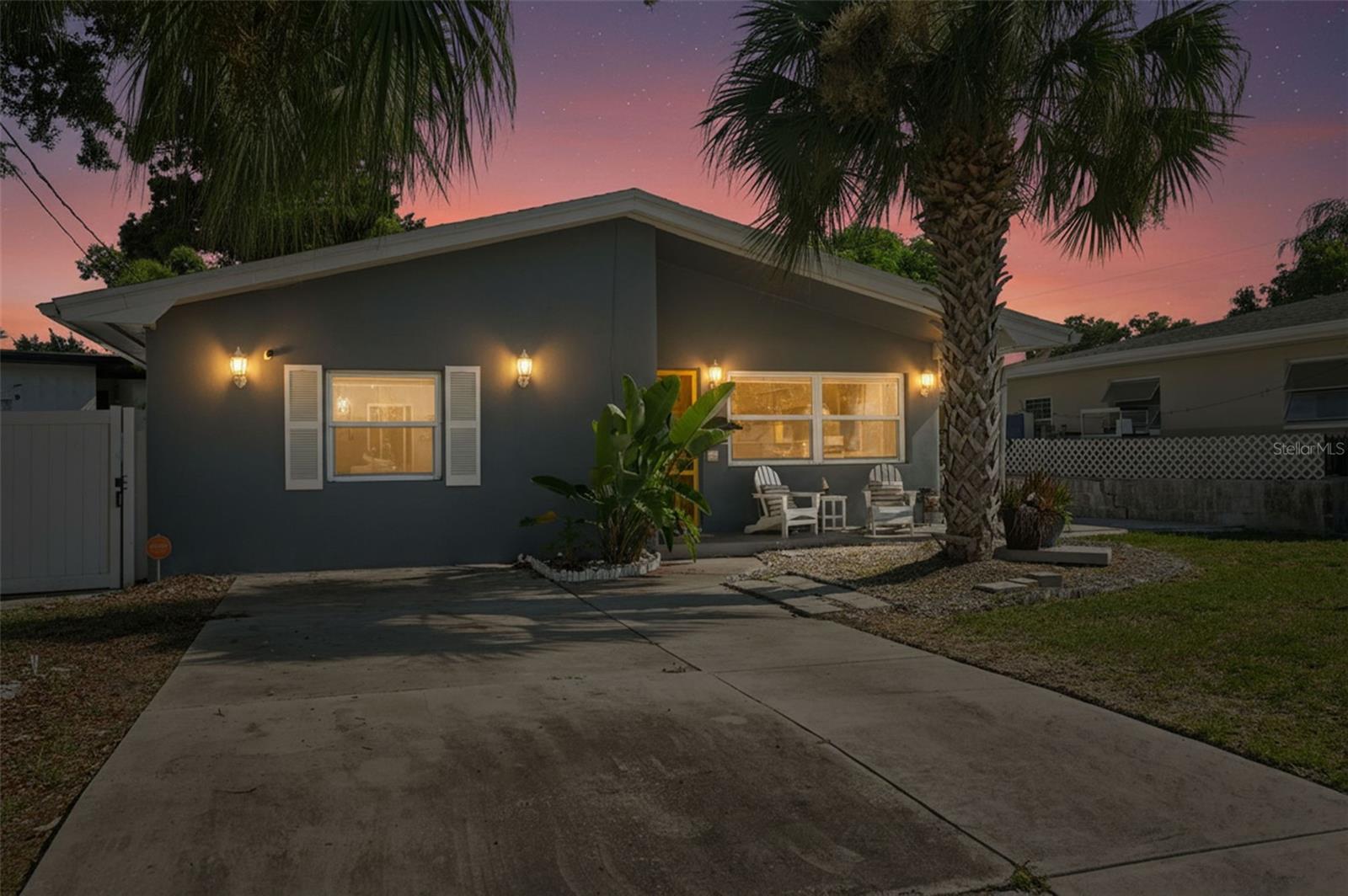 Perfectly capturing the charm of a Key West-style bungalow while remaining on the mainland, this exquisitely renovated concrete block 3-bedroom, 2-bathroom residence blends refined design, modern comfort, and effortless coastal living. Tucked away in a peaceful setting yet just minutes from Clearwater’s premier attractions, the home welcomes you with an open-concept layout filled with natural light, elegant ceramic tile flooring throughout, hurricane-rated windows, designer quartzite kitchen countertops, stainless steel appliances, and a newer gas range. Natural gas service powers the tankless water heater and gas dryer, delivering both luxury and efficiency.

Thoughtfully curated upgrades include a newer roof, updated HVAC system, refreshed fencing, and a whole-home water softener, creating a home that is as functional as it is beautiful. Every detail has been selected to provide a move-in-ready living experience.

Outside, the expansive paver hardscape surrounds three sides of the property, creating exceptional curb appeal and a low-maintenance lifestyle ideal for year-round enjoyment or a lock-and-leave second home. Inside, the home serves as a private sanctuary where the outside world fades away, creating an atmosphere of tranquility, comfort, and relaxation.

Ideally located just minutes from vibrant downtown Clearwater and the exciting Imagine Clearwater waterfront redevelopment, you'll also enjoy quick access to Clearwater Beach, Pier 60, Sand Key Park, the Clearwater Marine Aquarium, the Pinellas Trail, and numerous local parks. Tampa International Airport and St. Pete–Clearwater International Airport are both easily accessible, placing the best of the Gulf Coast right at your fingertips.

Whether you're seeking a full-time residence, a coastal retreat, or the quintessential Florida lifestyle, this exceptional home delivers timeless style, quality craftsmanship, and an unmatched location.