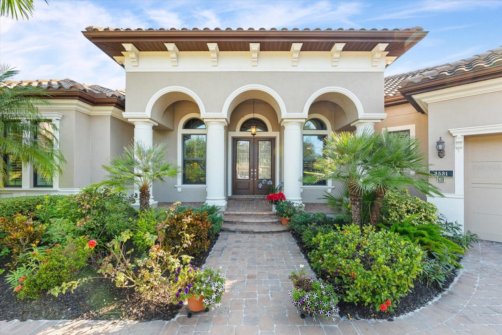 Don't miss this rare chance to acquire the BEST value for this fabulous home within *The Founders Club* (a 700-acre community)—Sarasota’s most exclusive private residential golf community—where all 275 residences were custom-built by the area's most prestigious builders. There are only 7 homes available now and this one is the BEST! No CDD fees. Low HOA fees. Club membership is optional. Take advantage of the $50,000 price reduction! The seller is motivated to sell quickly! You will love this home featuring 3 bedrooms, a den, and an additional multi-purpose room, along with 3 full bathrooms and a half-bath. Built in 2013, this custom residence was designed to maximize indoor-outdoor living; it features a beautiful, spacious pool on a lanai that includes covered areas for both dining and lounging. The lovely backyard, adorned with mature trees and lush landscaping, offers plenty of space for pets and recreational activities. Enjoy 3,182 square feet of thoughtfully designed living space situated on a lot of nearly half an acre. A partial view of the golf course's 17th hole adds a picturesque touch to this tranquil setting. The Club and the Robert Trent Jones-designed golf course are undergoing renovations this summer; consequently, a reciprocity agreement with other elite local clubs is in effect from now through the Summer! Take this opportunity to play on the region's best courses and return to enjoy the BEST in the fall! Upon entering the home, you will find an office located near the front door, directly across from the dining room and the main "Great Room." Key features include soaring ceilings, abundant storage space, and an open-concept layout that flows seamlessly from the gourmet kitchen into the spacious living and dining areas. All rooms are situated on a single level, showcasing timeless architecture and high-end finishes. The primary suite features two spacious walk-in closets, each custom-designed with built-in cabinetry. Bathed in natural light, the primary bathroom includes a garden tub, a separate shower, double vanities, and a dedicated seated vanity area, offering a perfect blend of comfort and functionality in a spa-like setting. The other two bedrooms, each with a private en-suite bathroom, are located on the opposite side of the house. The three-car garage offers ample space for three vehicles and the angled area offers a triangle for a golf cart and extra storage.. The "Florida Basement," provides additional AC storage space. Furniture is included in the sale, with the exception of items marked with a red dot. This home is truly move-in ready, so you can start enjoying this lifestyle right away! Ask about incentives!