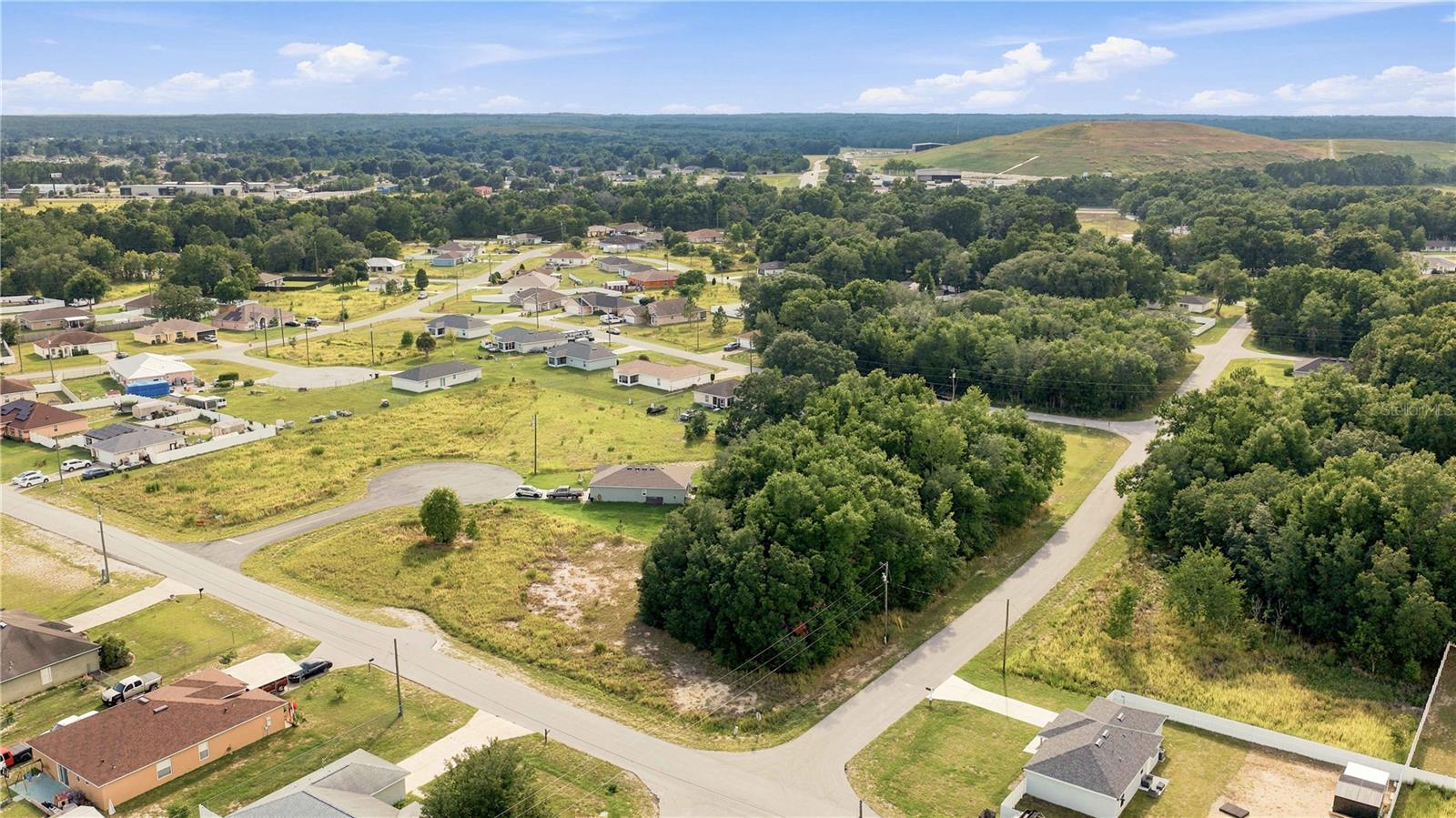 Build your dream home on this 0.25-acre lot in the established community of Silver Springs Shores! This desirable homesite offers added flexibility for home placement and easy access while being conveniently located near shopping, dining, schools, parks, and medical facilities. Enjoy the freedom of no HOA and the opportunity to build when you're ready. Looking for more space? The adjacent 0.25-acre corner lot is also available for purchase, giving you the rare opportunity to own side-by-side parcels for a larger homesite or future investment. Conveniently located just a short drive from Ocala, The Villages, and Silver Springs State Park, this property is perfect for building your future or adding to your investment portfolio.