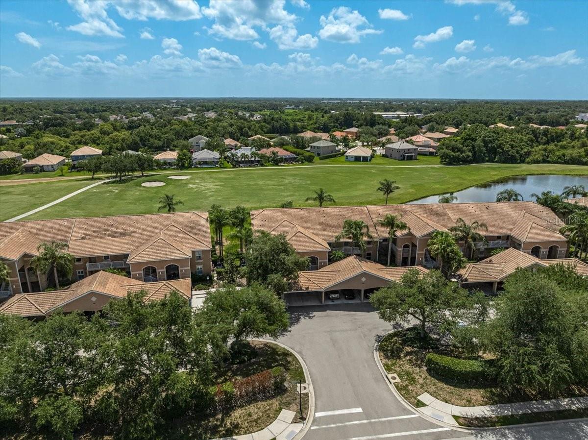 Virtually Staged. SELLER FINANCING AVAILABLE!   This spacious 2-bedroom, 2 bath PLUS DEN condo features the largest floor plan in the community and enjoys beautiful golf course views.

Inside, you'll find soaring vaulted ceilings, a freshly painted interior, upgraded hurricane-impact windows and sliding glass door, and easy care laminate and tile flooring throughout.  

The versatile den is ideal for a home office, guest space, or hobby room, while the covered parking space is conveniently located just steps from your front door with abundant guest parking nearby.

Enjoy an active, maintenance-free lifestyle with exceptional resort-style amenities offered at a very reasonable cost. A conveniently located swimming pool is steps away from the property and the main community campus features a large pool with extensive decking and plenty of shade, spa and splash zone, sports courts, fitness room and meeting space for clubs and events.  Conveniently located near shopping, dining, golf, and Sarasota's world-famous beaches, this is a unique opportunity to own a move-in-ready home with the added benefit of seller financing, making homeownership more accessible for qualified buyers.
